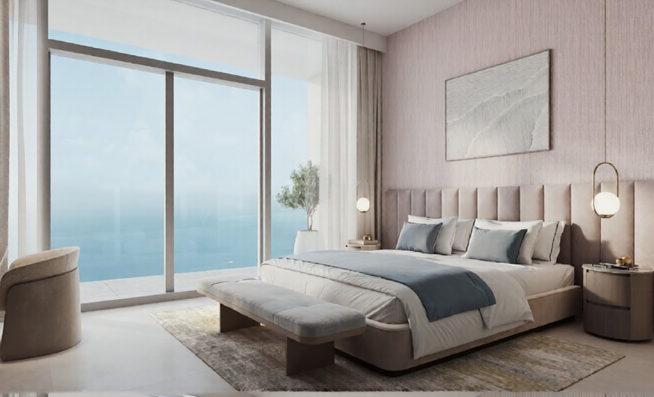 Elegant bedroom in the Hilton Residences with large windows overlooking the ocean and soft, neutral-toned furnishings.