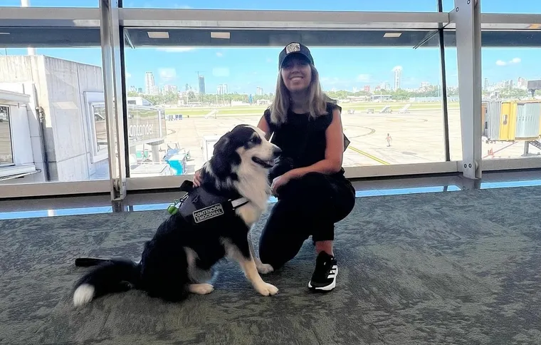 Keila Barral Masri alongside her dog.