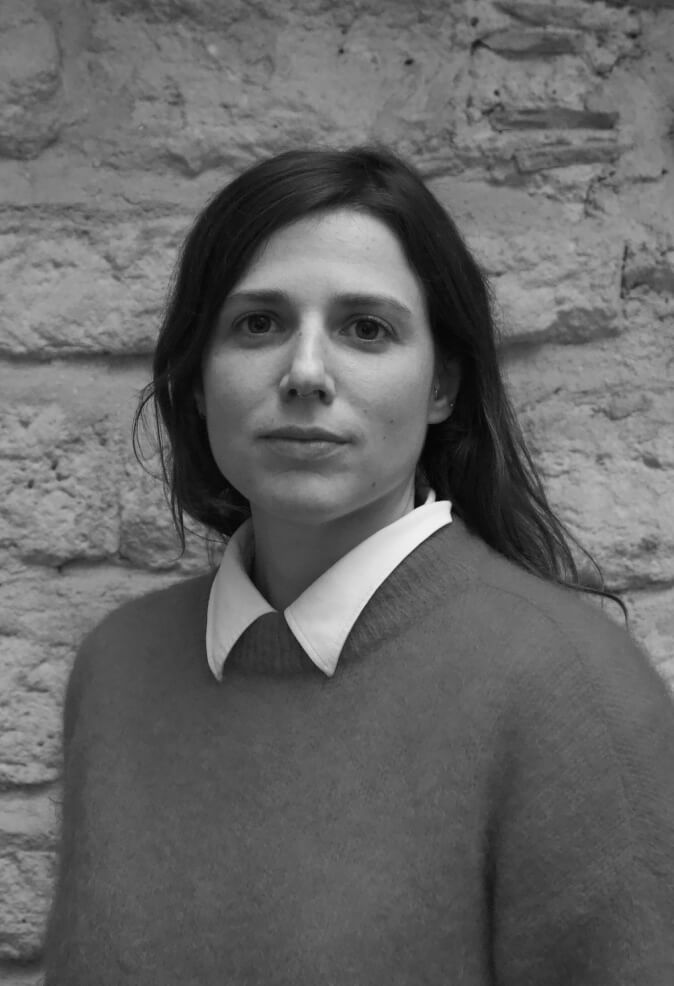 shallow focus photo of woman in gray jacket