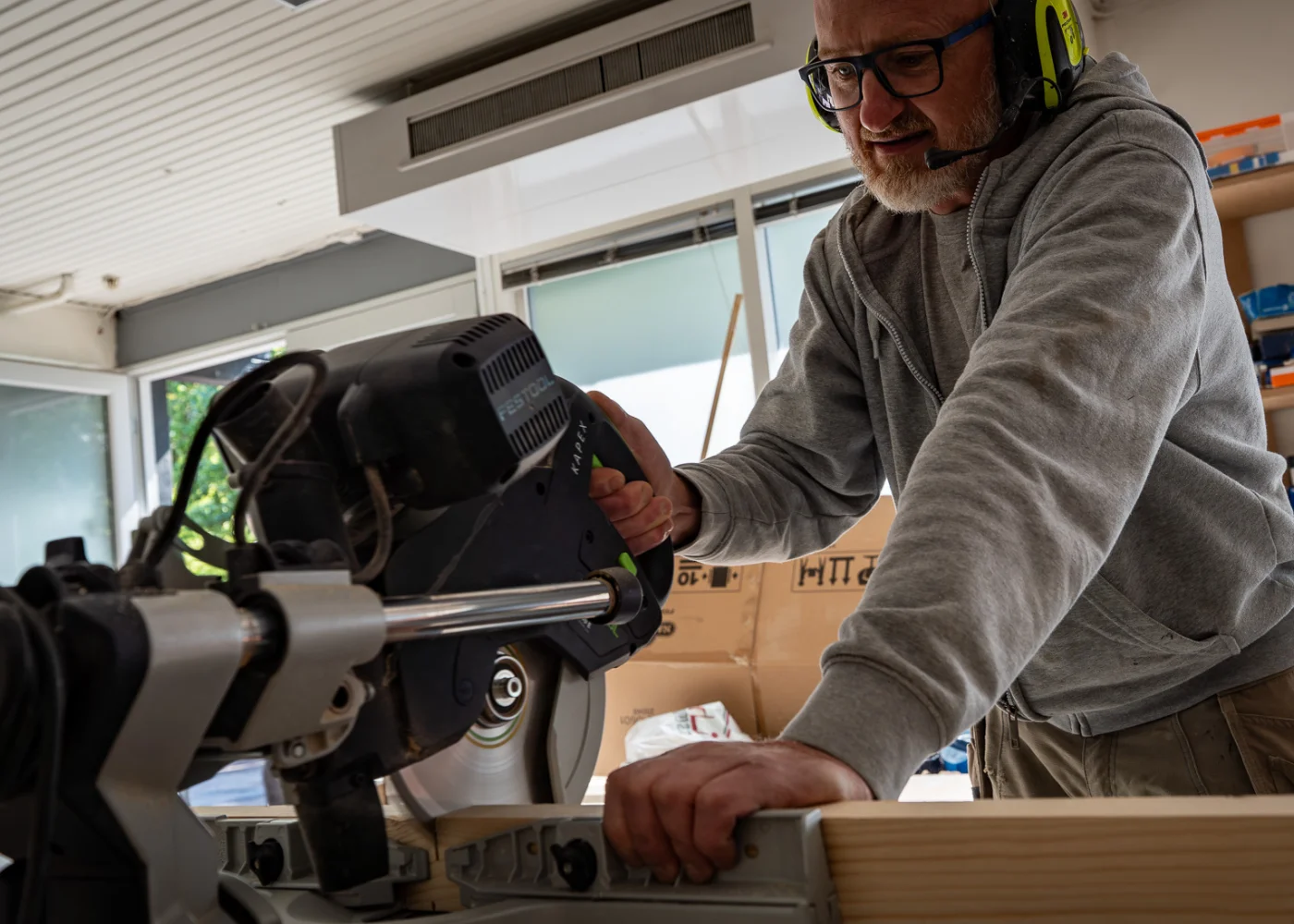 Craftsman cutting wood for decking and outdoor structures