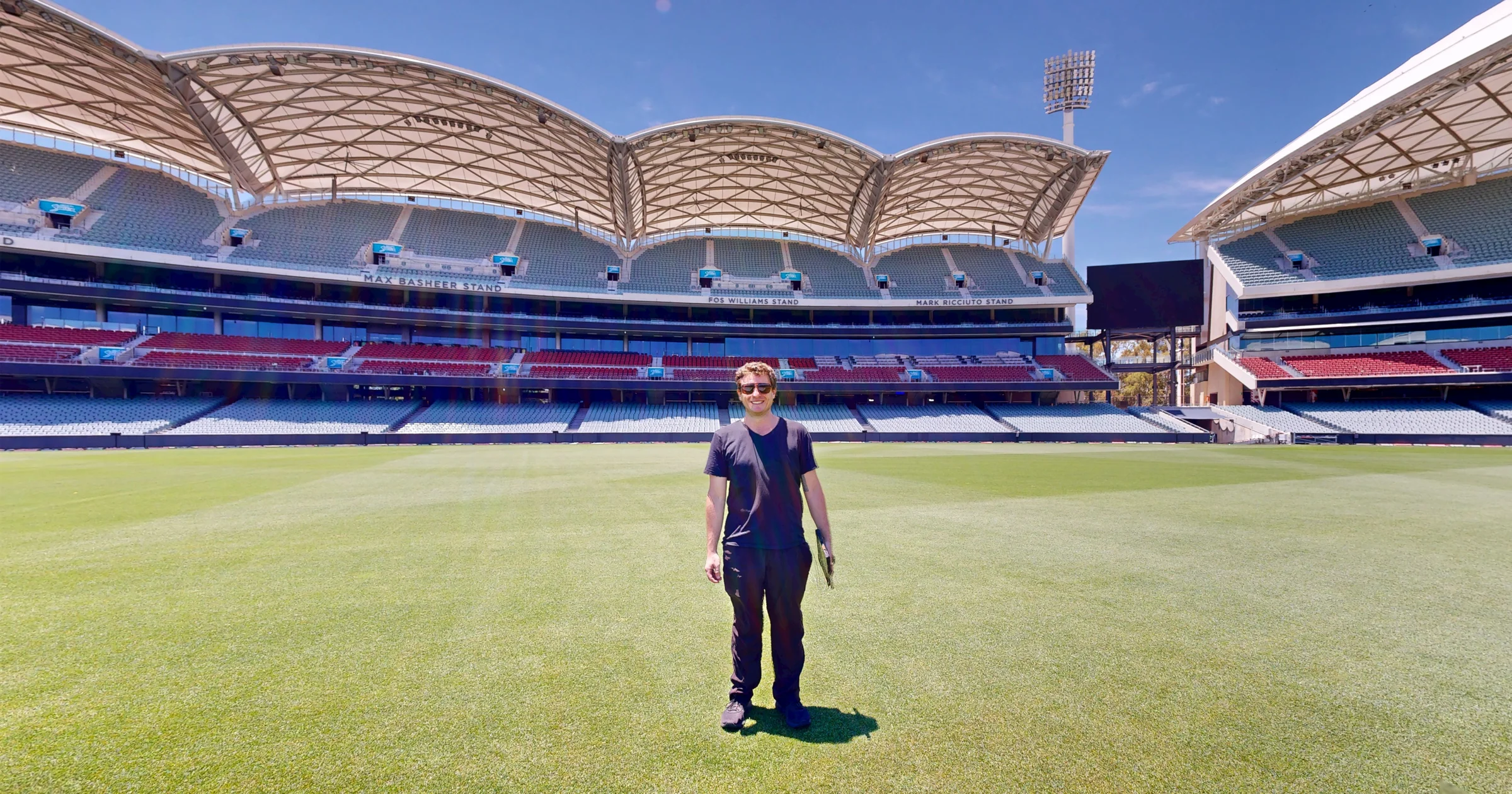 Michael Petros of ABM visual standing on the pitch at Adelaide Oval