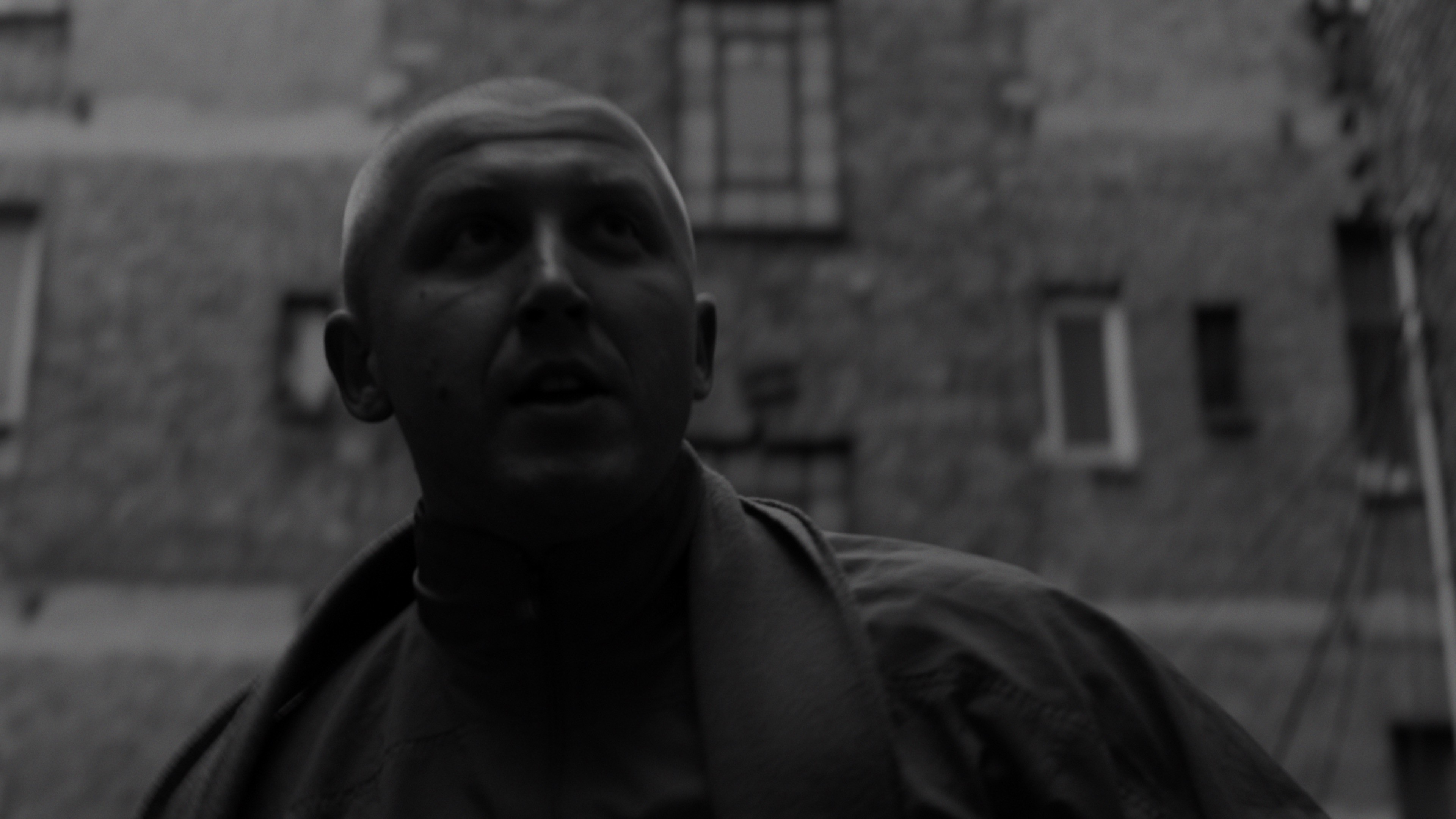 Expressive close-up portrait of an aggressive man shouting, dramatic lighting.