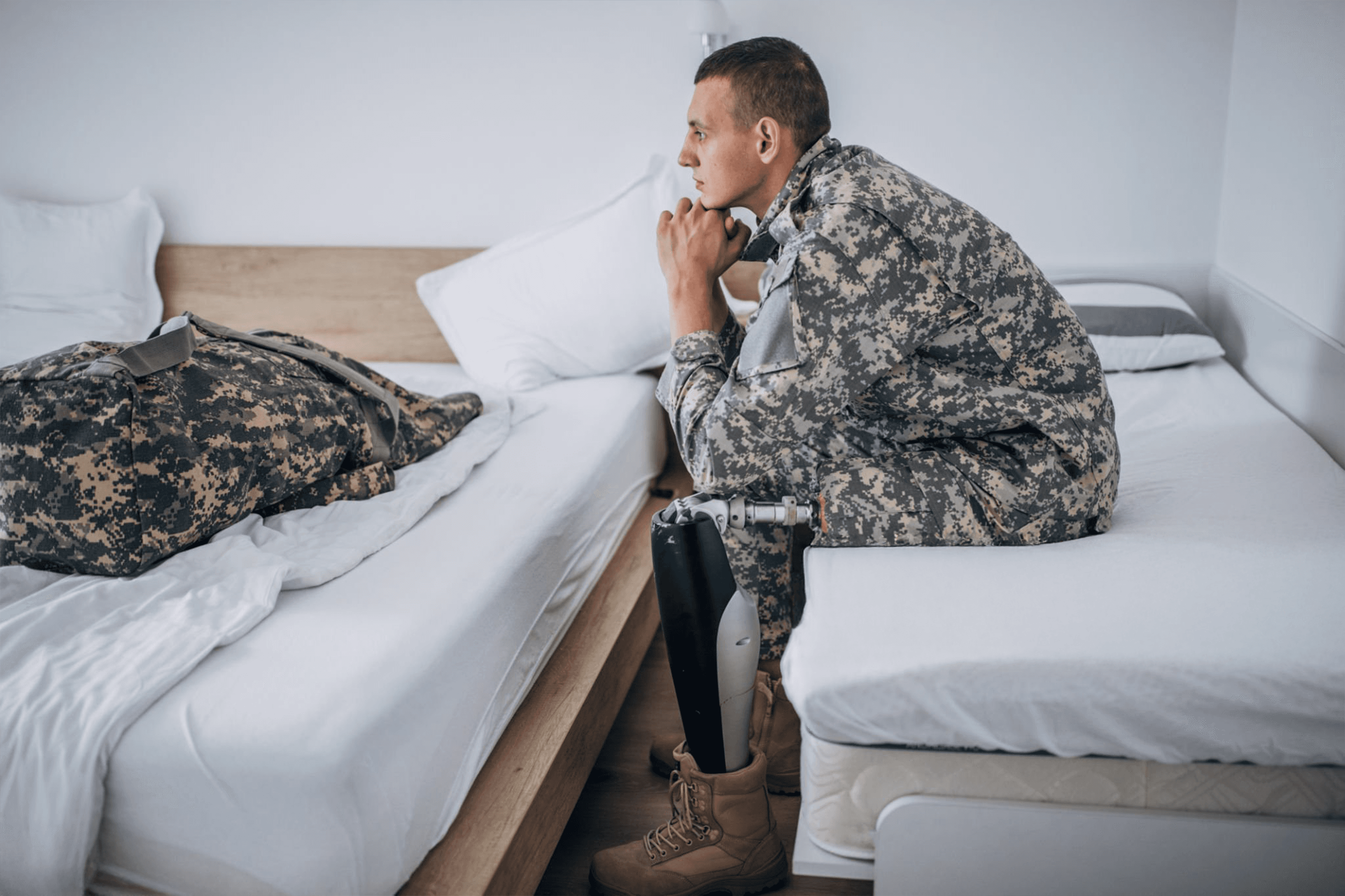 Wind turbine overlooking bright green farmland and scattered buildings