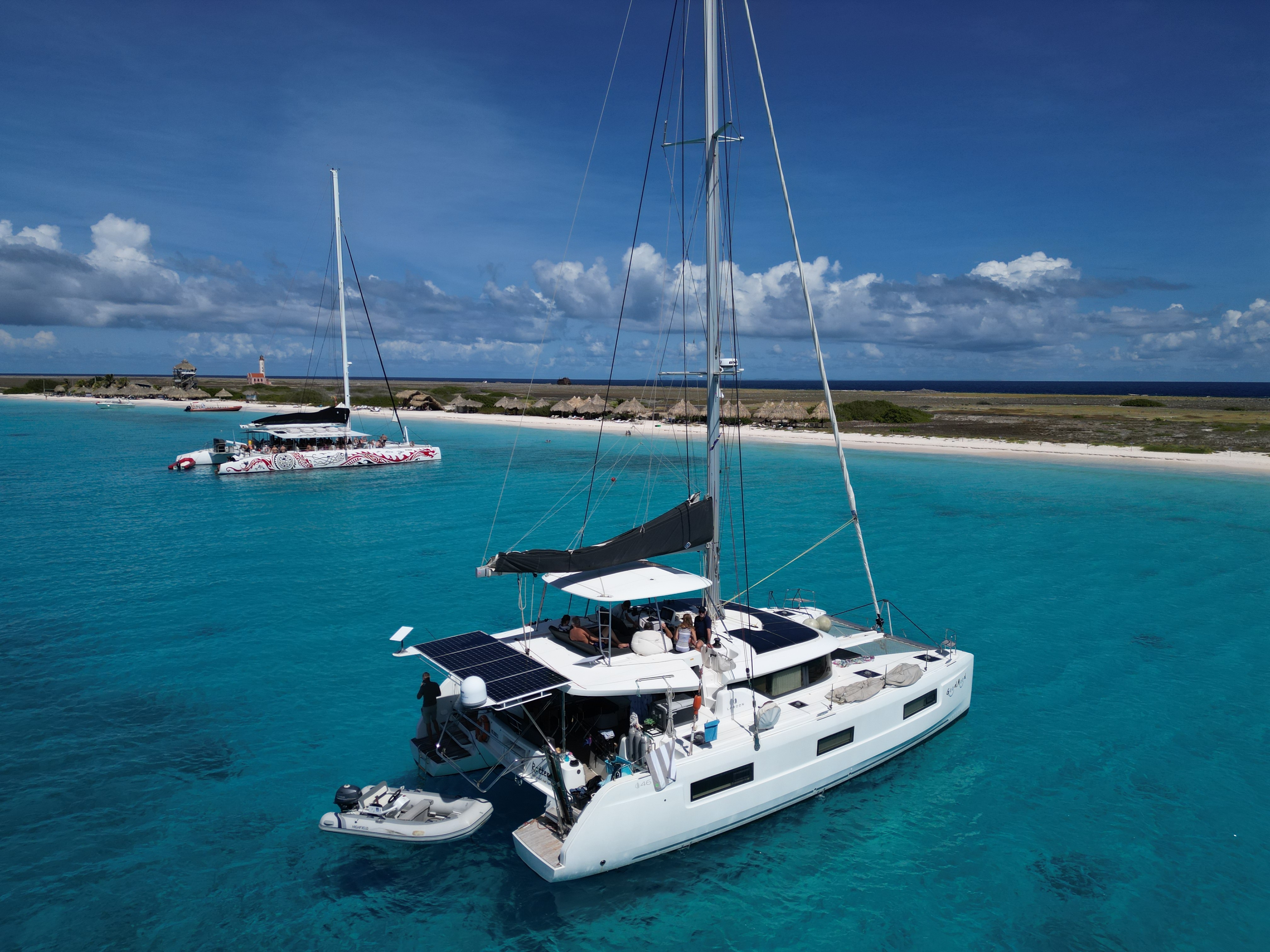 Good Mood private catamaran with guests on turquoise water off Curaçao’s coast