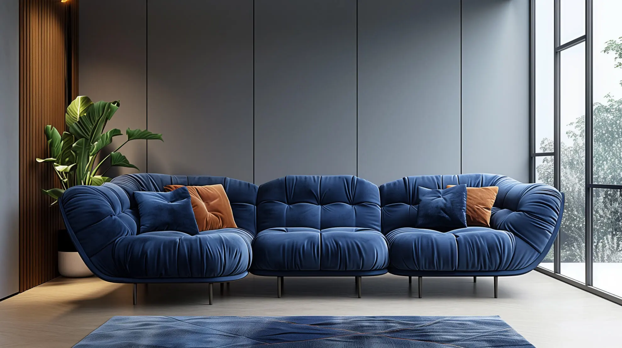 Contemporary living room with plush blue sofas, orange accent pillows, a large potted plant, and floor-to-ceiling windows.