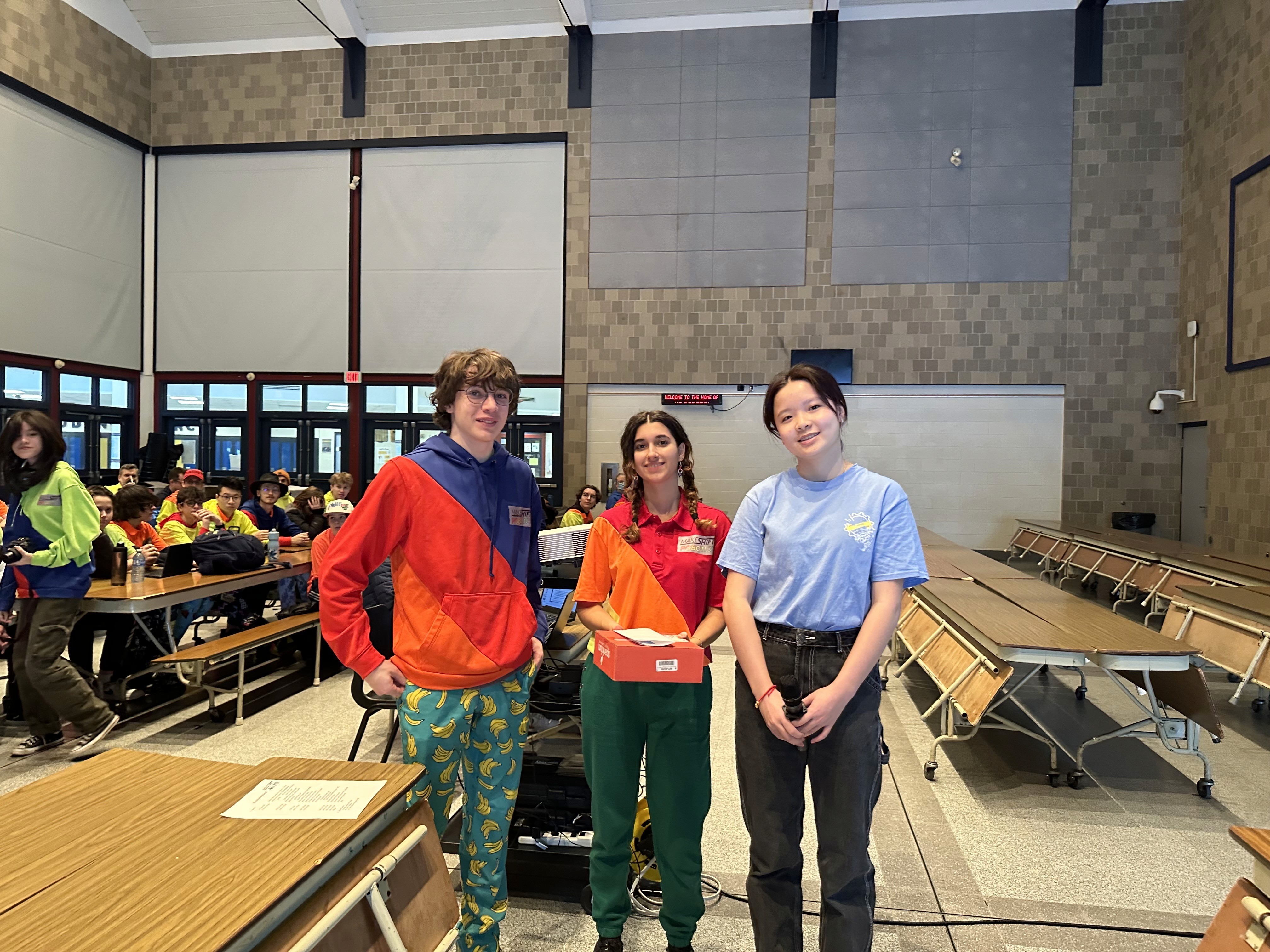 FRC 10015 Team Co-captain, Queena Lin, presents a XRP gift and a thank-you letter to our mentor team FRC 4039 Makeshift.