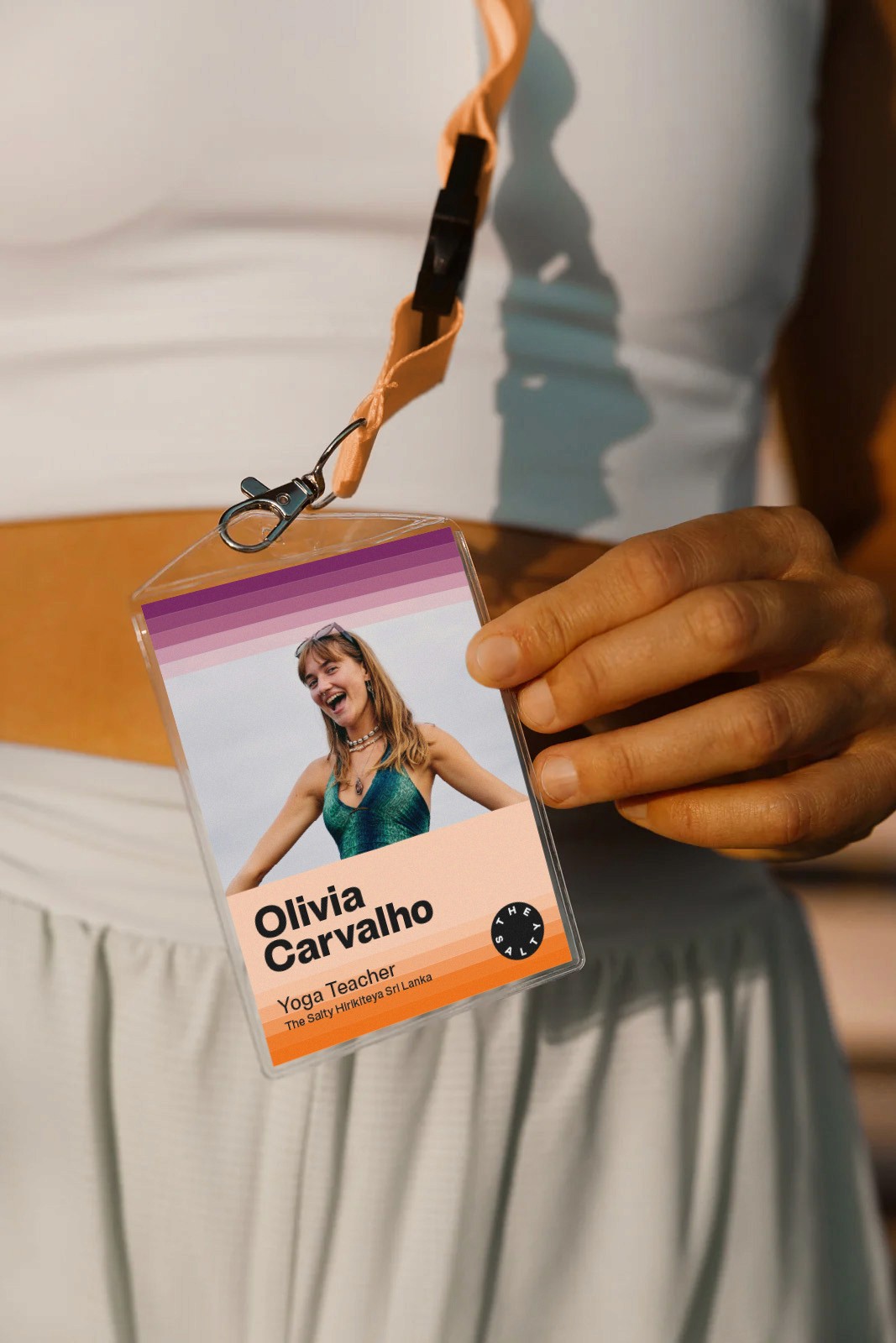 Employee lanyard and pass with The Salty logo and staff role printed on the card.