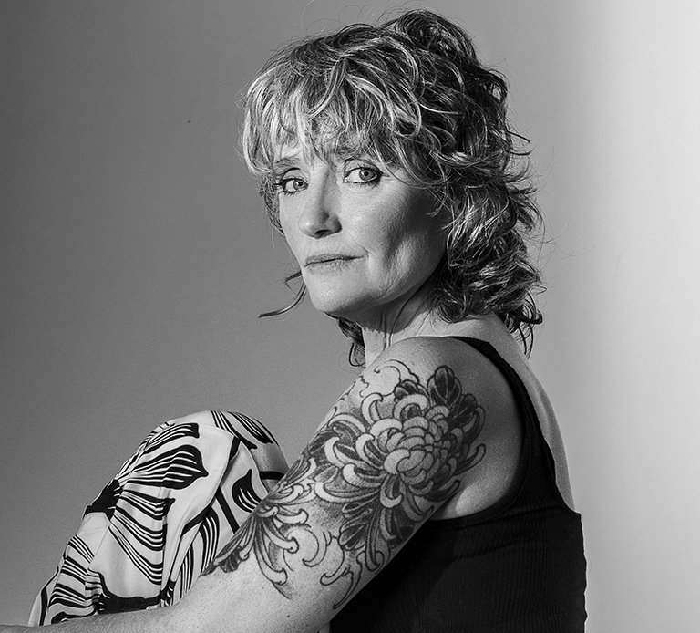 Rustic cabin in a golden field at sunset