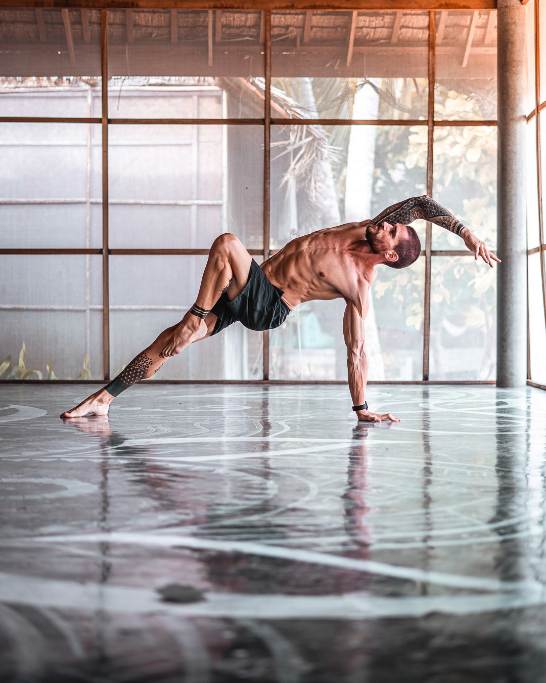 Flo practicing a strong balance yoga pose.
