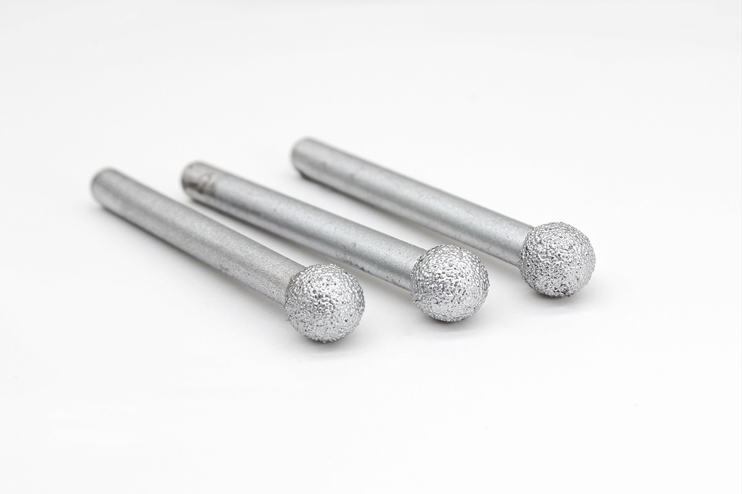 Three spherical Diamond Carving Bits aligned in a row, designed for smooth, rounded carving in granite and marble.