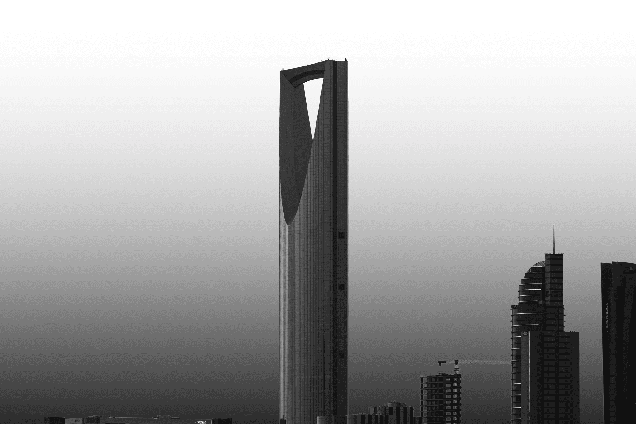 The image features a stylized figure with a unique, abstract design. The main subject appears to be a humanoid form with a wooden texture, wearing a blue robe.