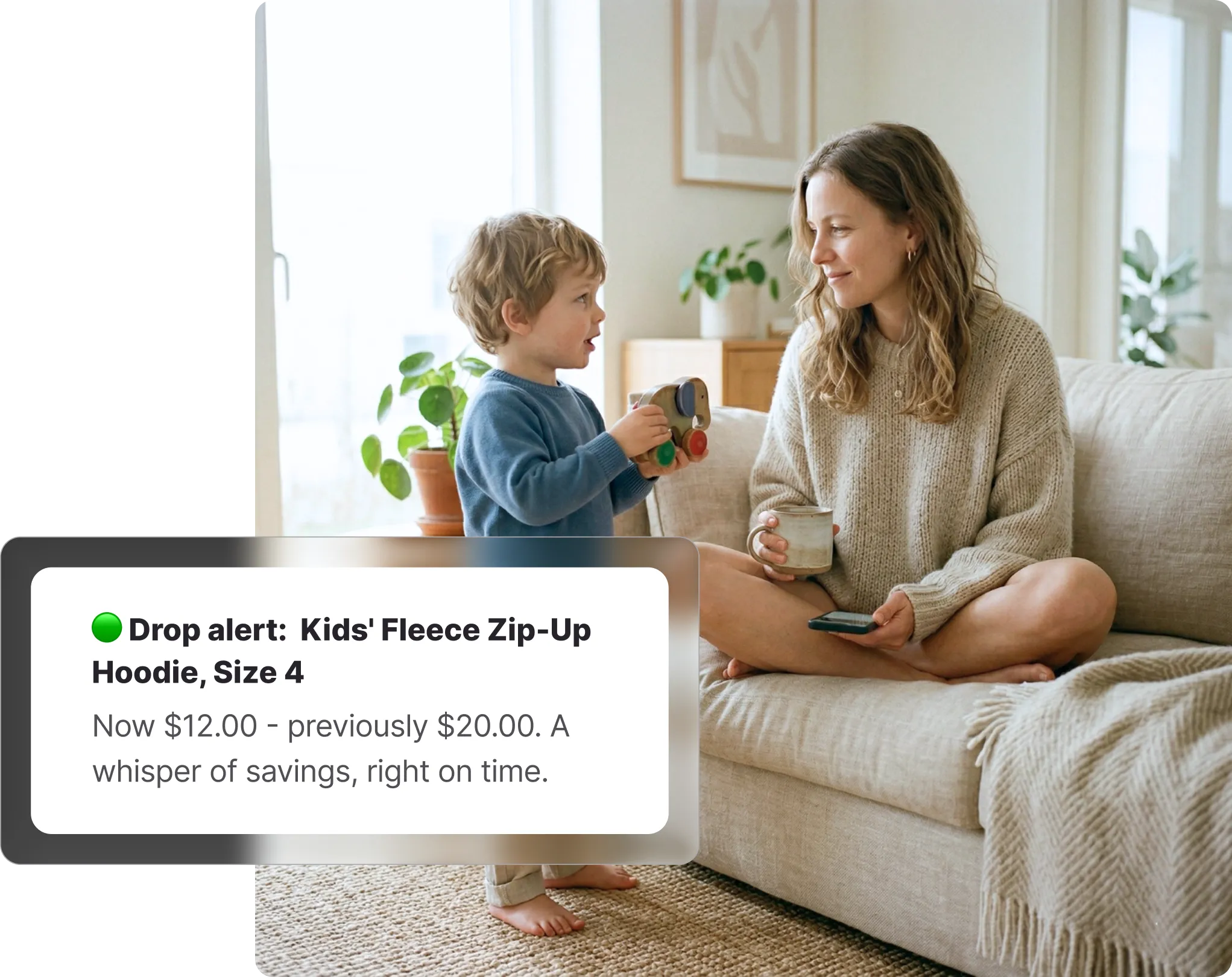 Mother sitting on a sofa with her young child, with a Whisprice price drop alert showing a Target Kids' Fleece Zip-Up Hoodie dropped from $20 to $12.