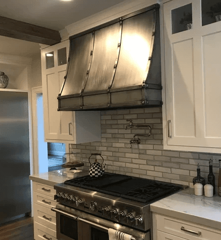 Steel oven hood in modern upscale kitchen fabricated by TratFab Star Idaho.