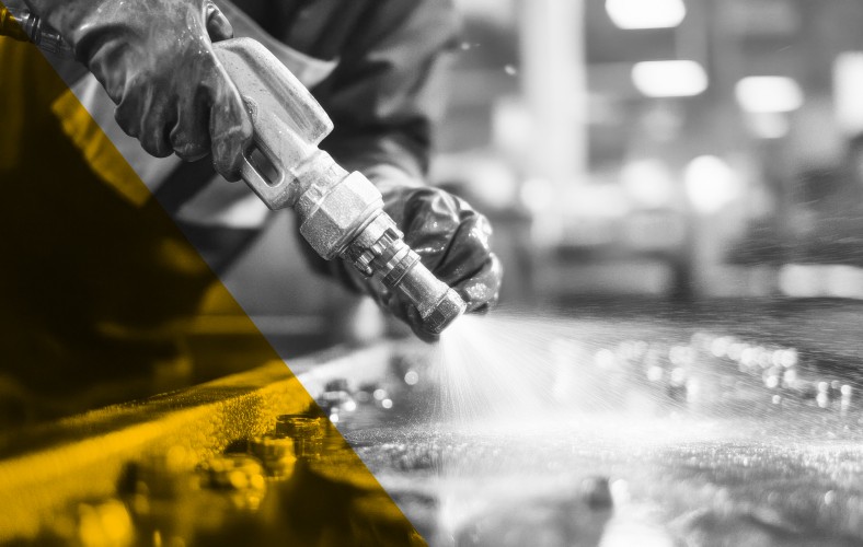 Industrial technician measuring materials in a fabrication setting, representing AI-driven operational efficiency