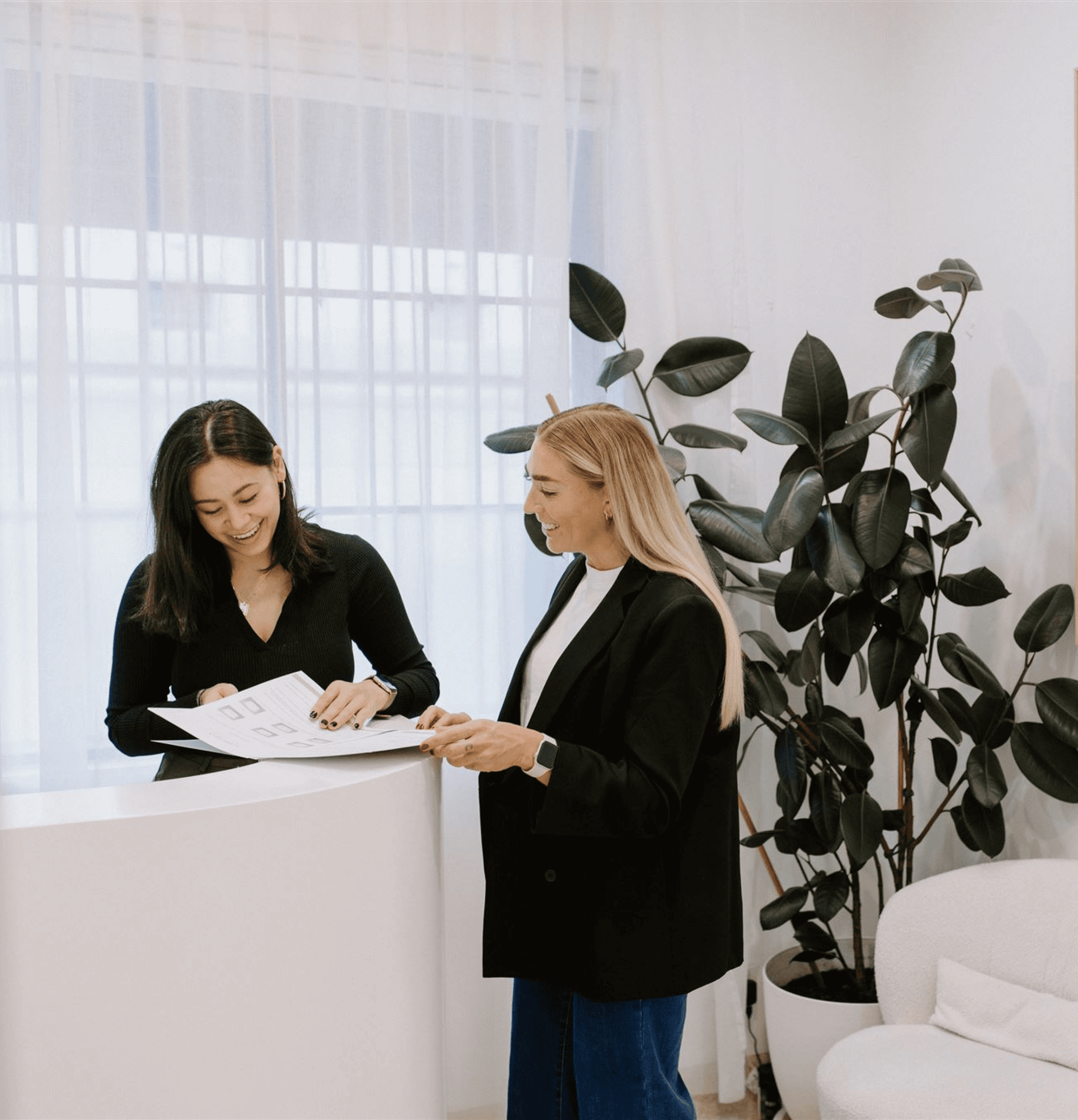 Dental receptionist explaning treatment process and costs in detail in a relaxing environment at Surry Hills Dental Centre