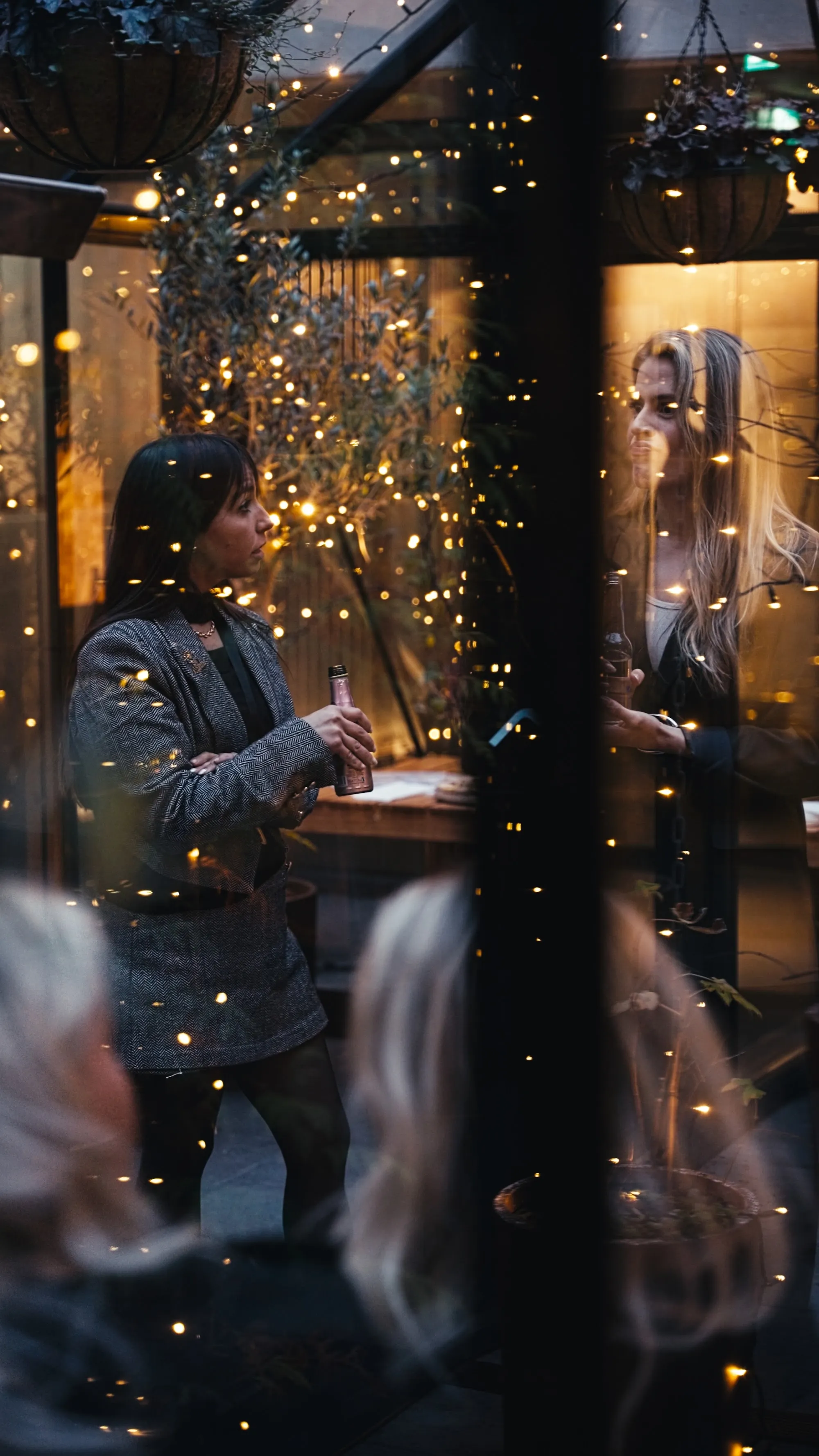 Guests gathered in the Exeter Hotel greenhouse strung with fairy lights