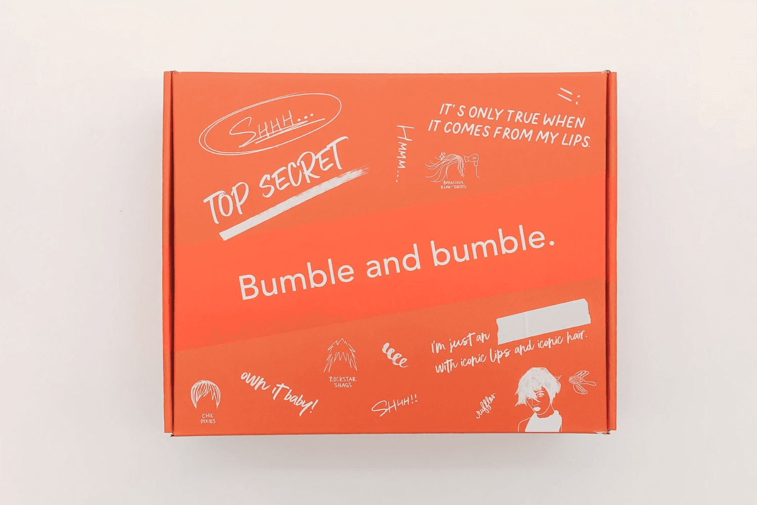 White branded cap with turquoise logo placed on fresh lemons in a red bowl