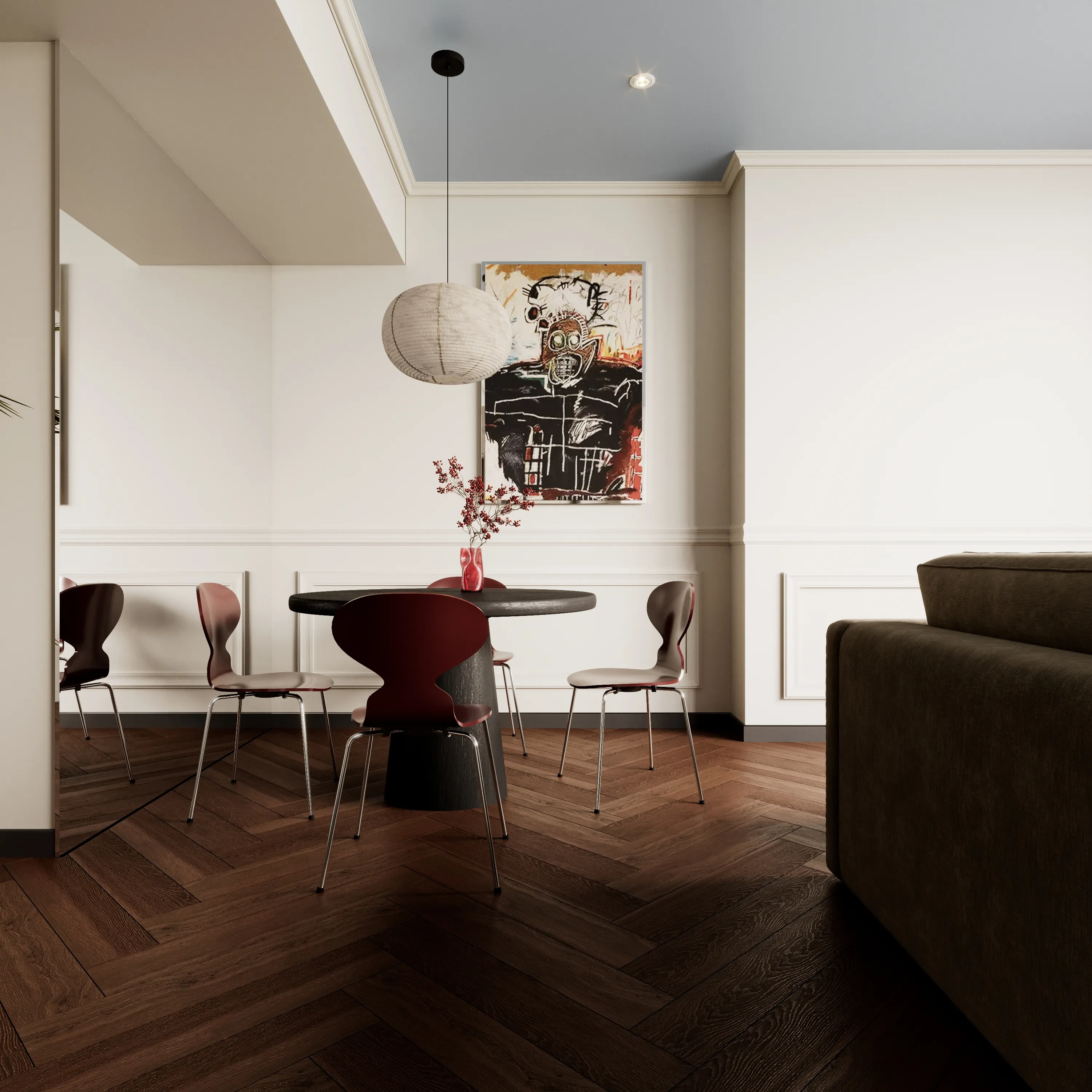 Designer and colourful dining space with a big round lamp.