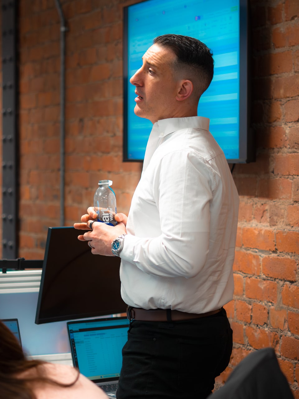 A PSS Tax consultant talking through a construction claim in front of a project screen