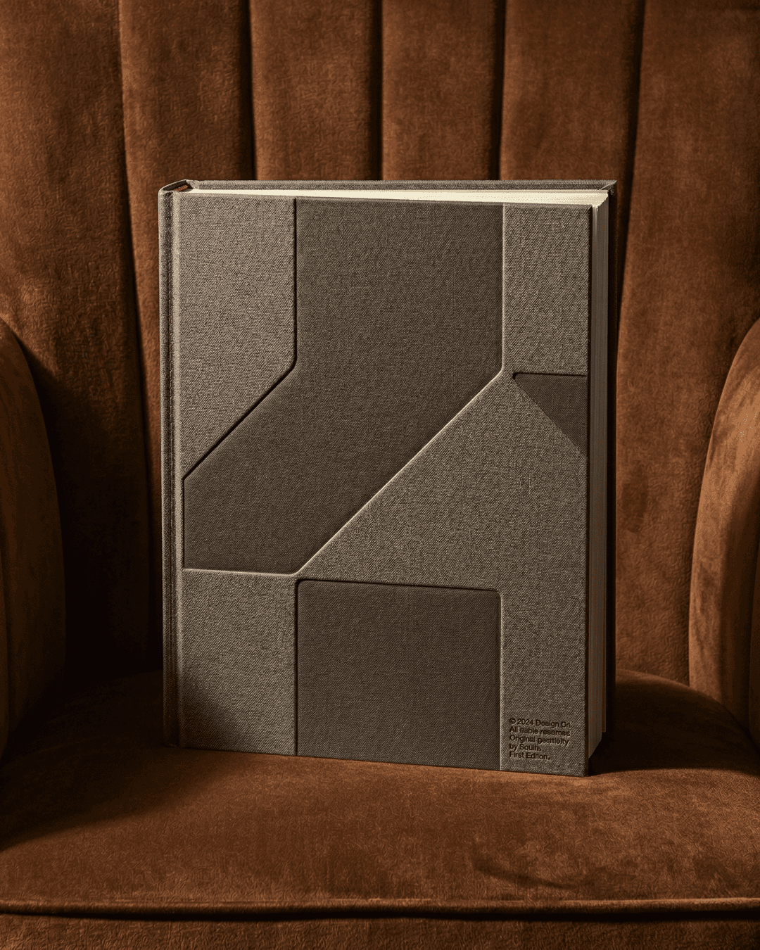 Homco brand book — textured hardcover on dark wood, asset design for premium construction identityomatic Urban Scenes