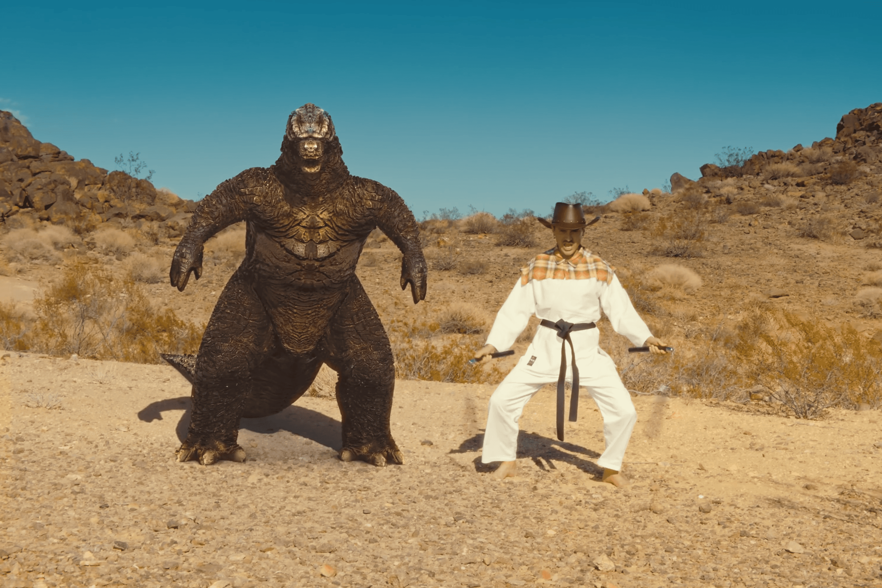 Silhouette of a person walking on a modern walkway
