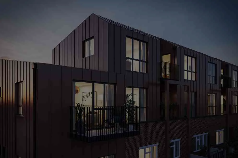 Modern glass house perched on a cliff edge, illuminated warmly against a serene, blue dusk backdrop. Overlooks a calm ocean, conveying tranquility.