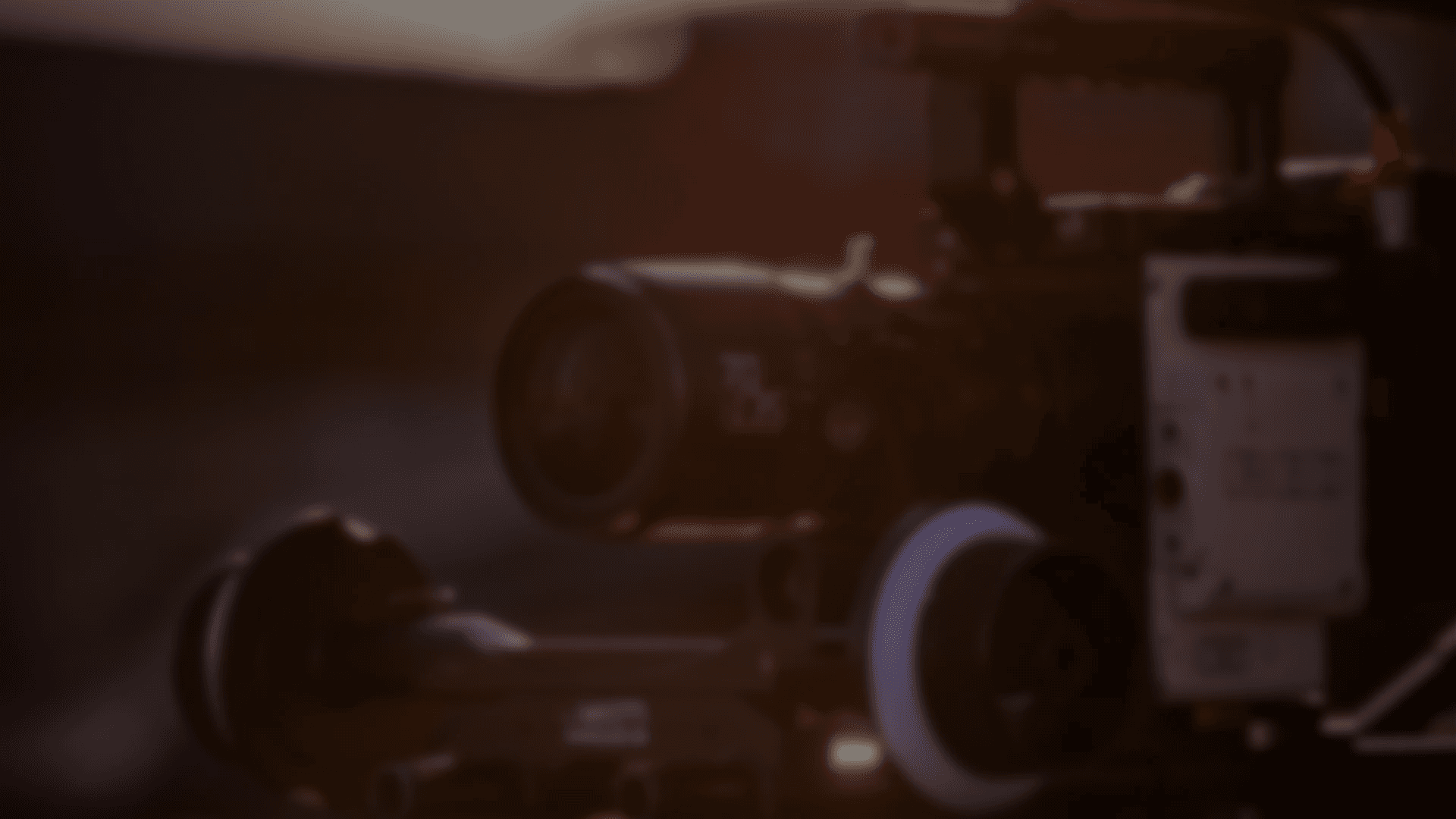 Close-up of camera buttons and dials, monochrome.