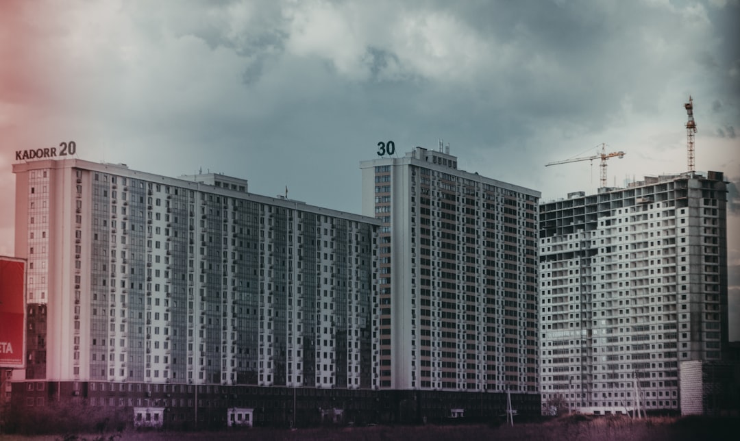 white high rise building under white sky during daytime
