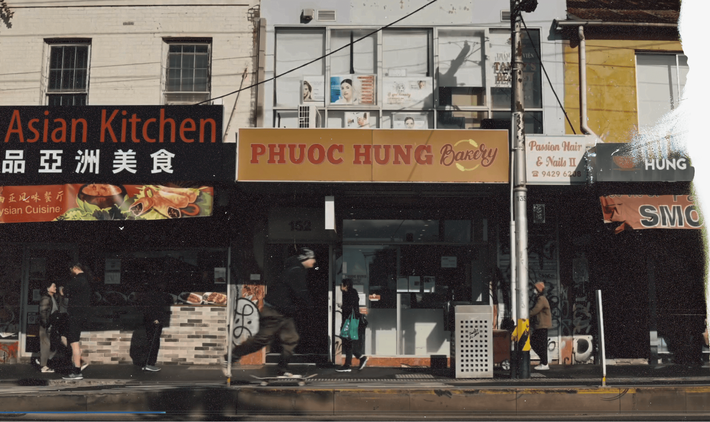 Stack of modern books and magazine with minimalist cover design on leather chair