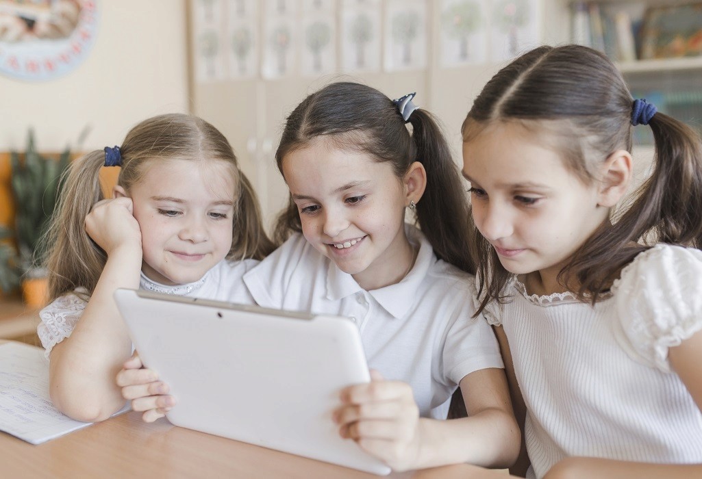 A school building stands against the backdrop of a clear sky
