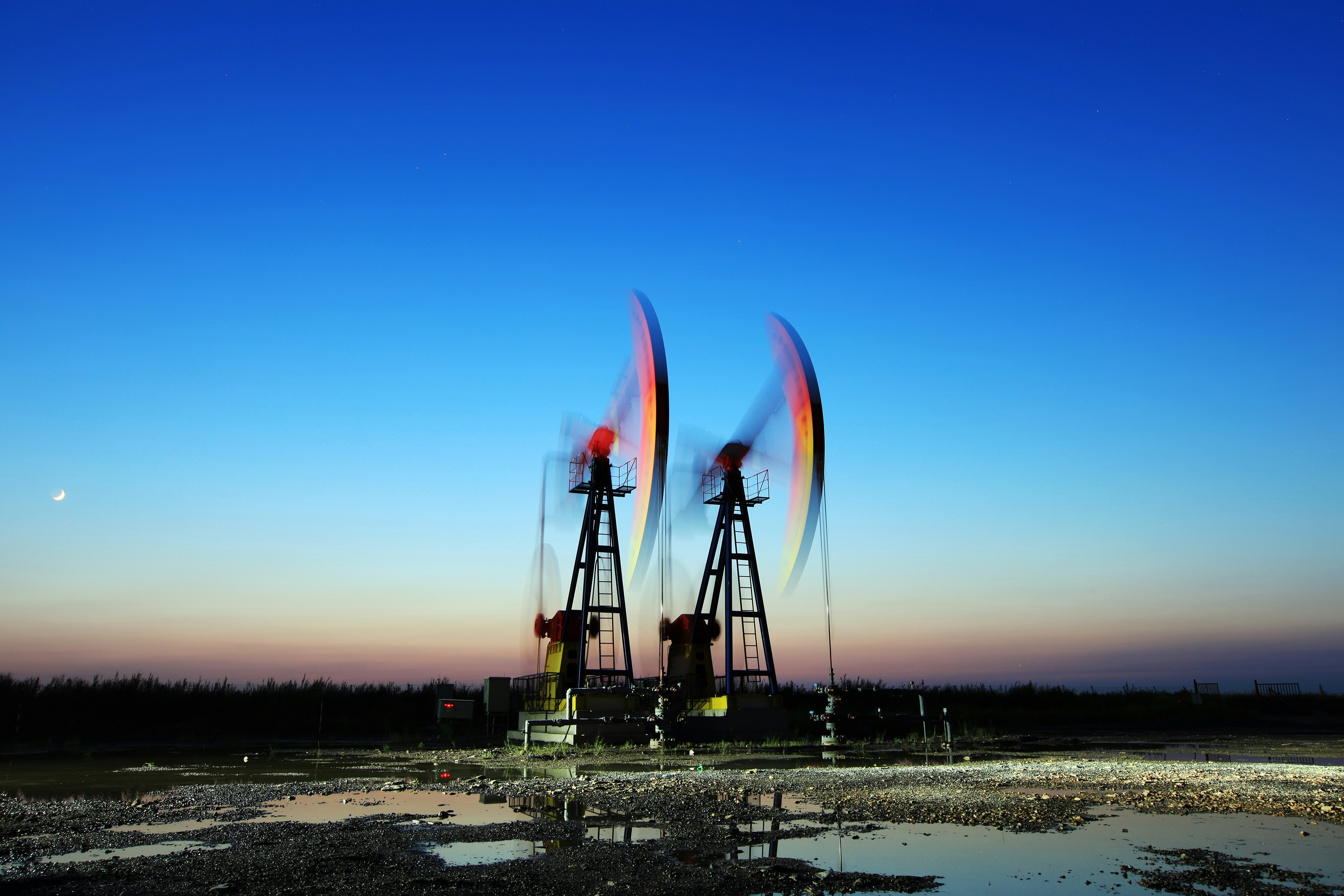 Woman holding a smartphone looking through the glass 
