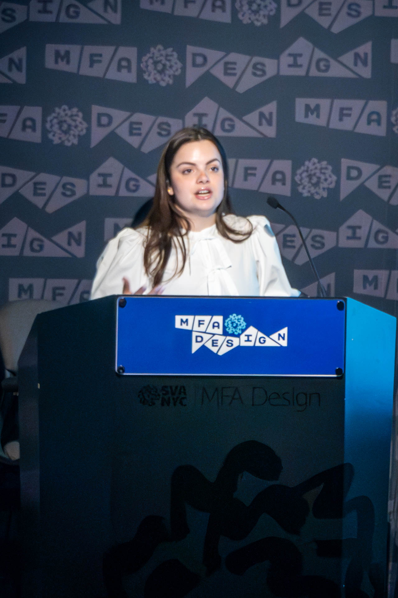 student at a podium giving a presentation