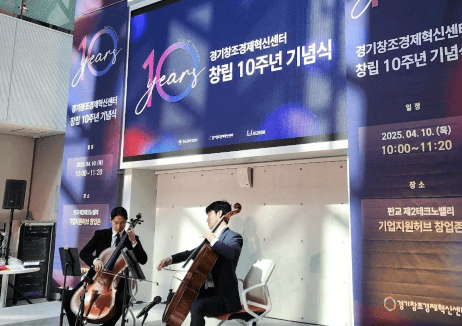 A wide shot of a vineyard with rows of vines stretching into the distance.