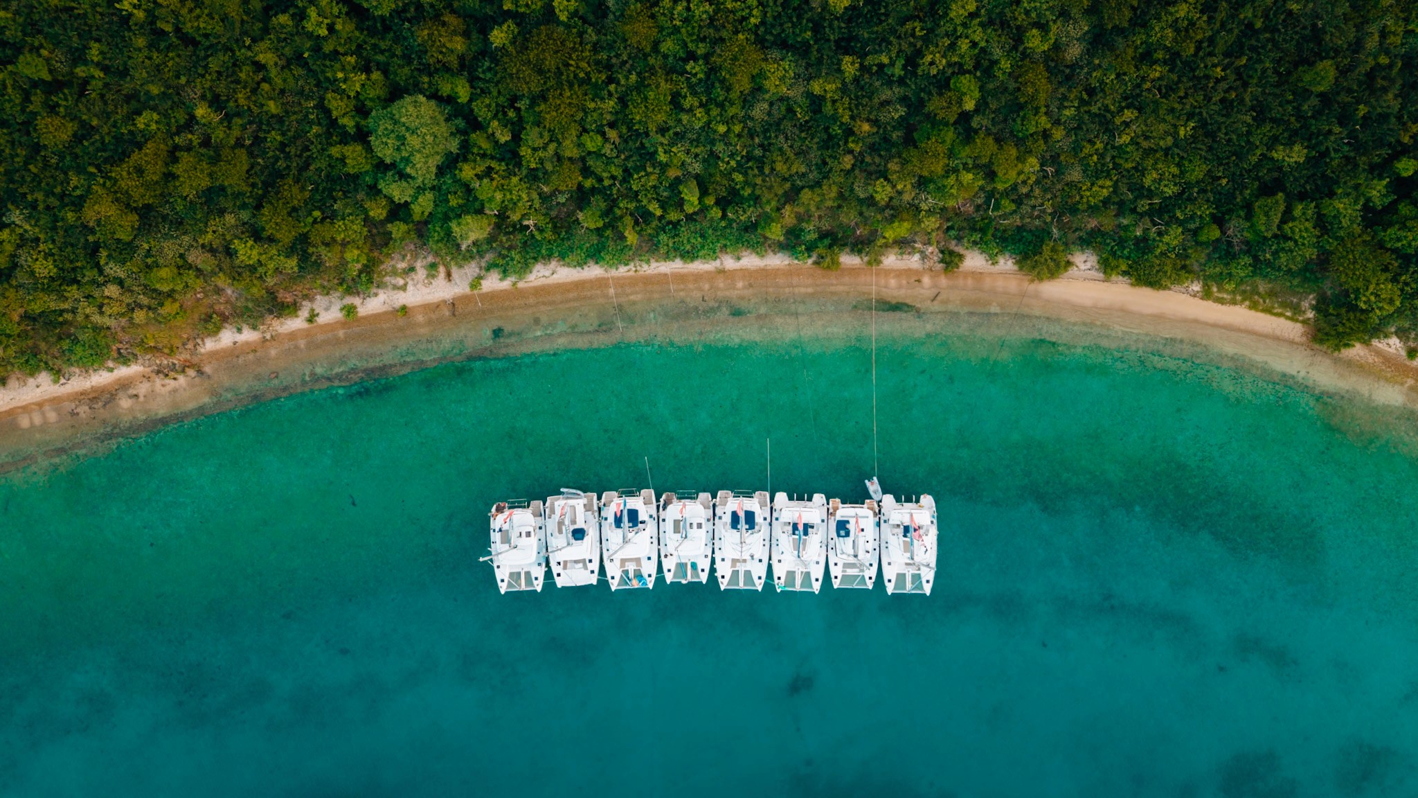 Professional drone content showing Yacht Week boats sailing in the British Virgin Islands
