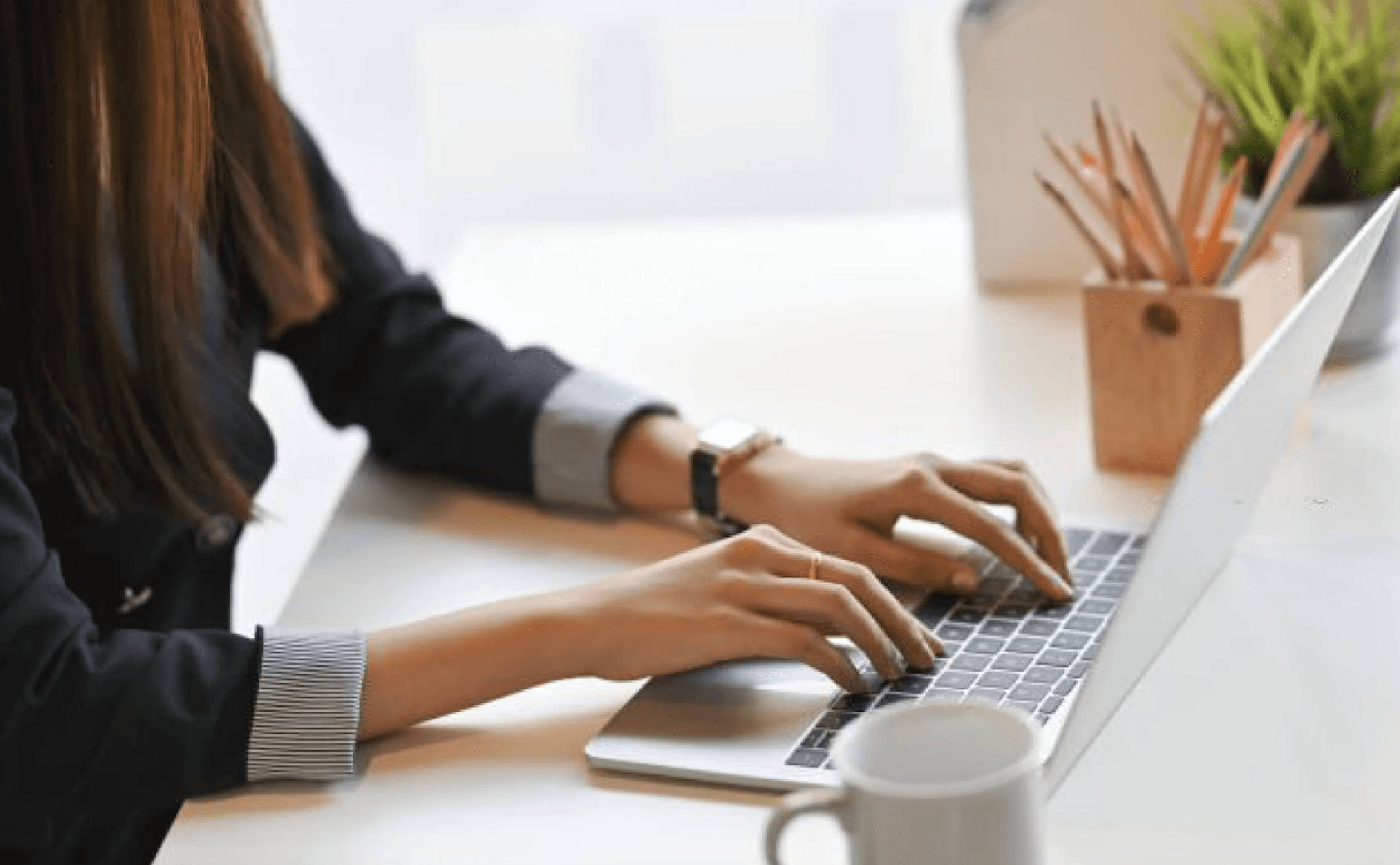 woman typing on computer