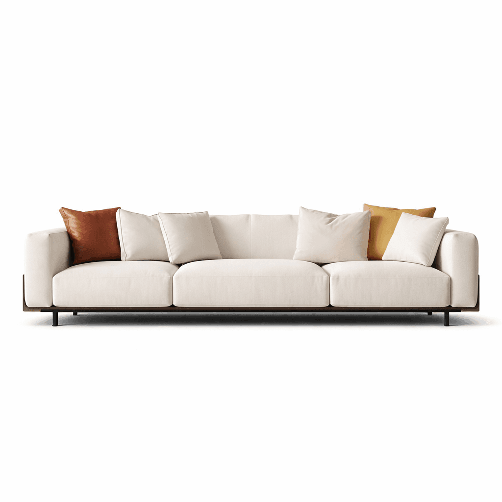 Extended off-white upholstered seating with loose scatter cushions and continuous metal base