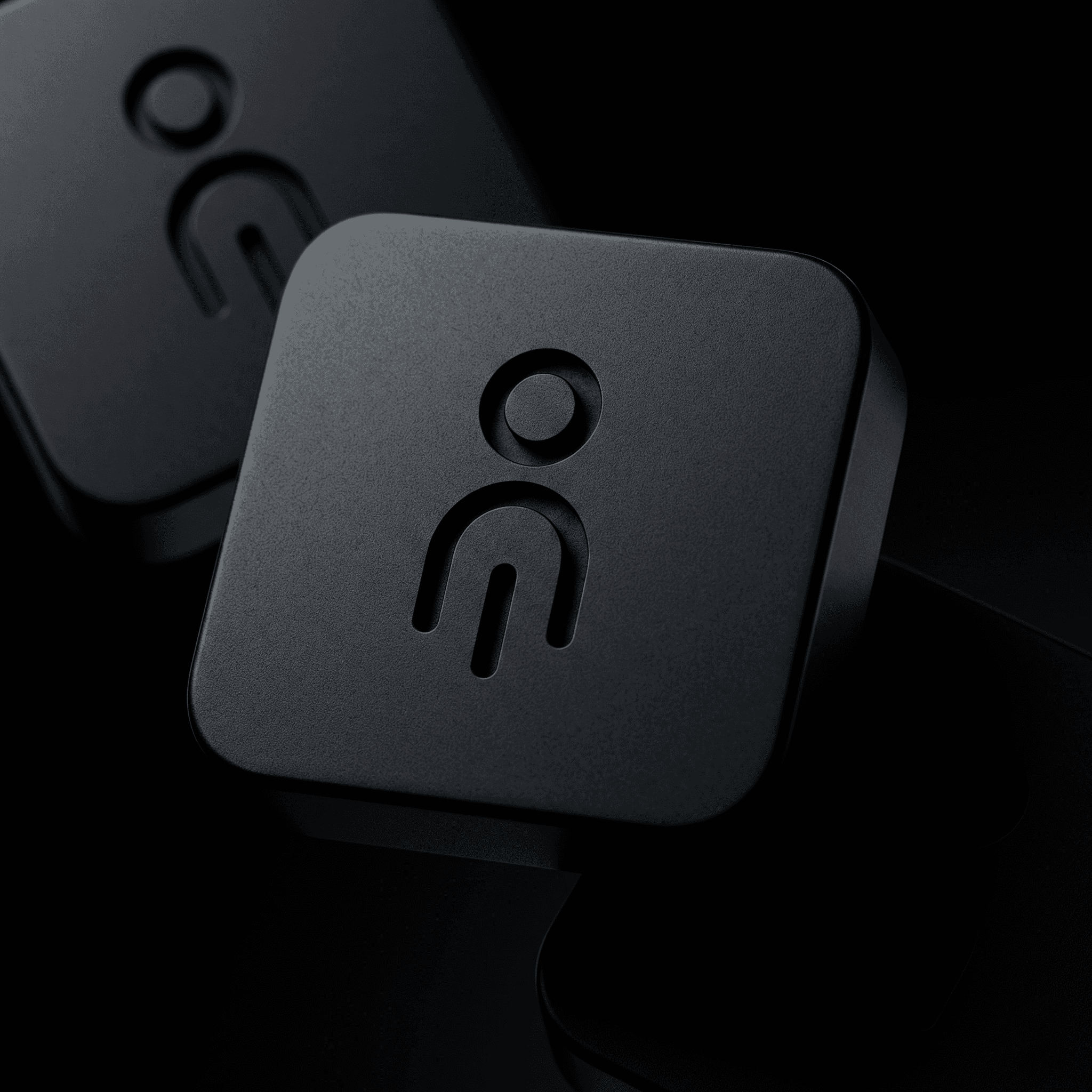 a close up of a black object with a black background