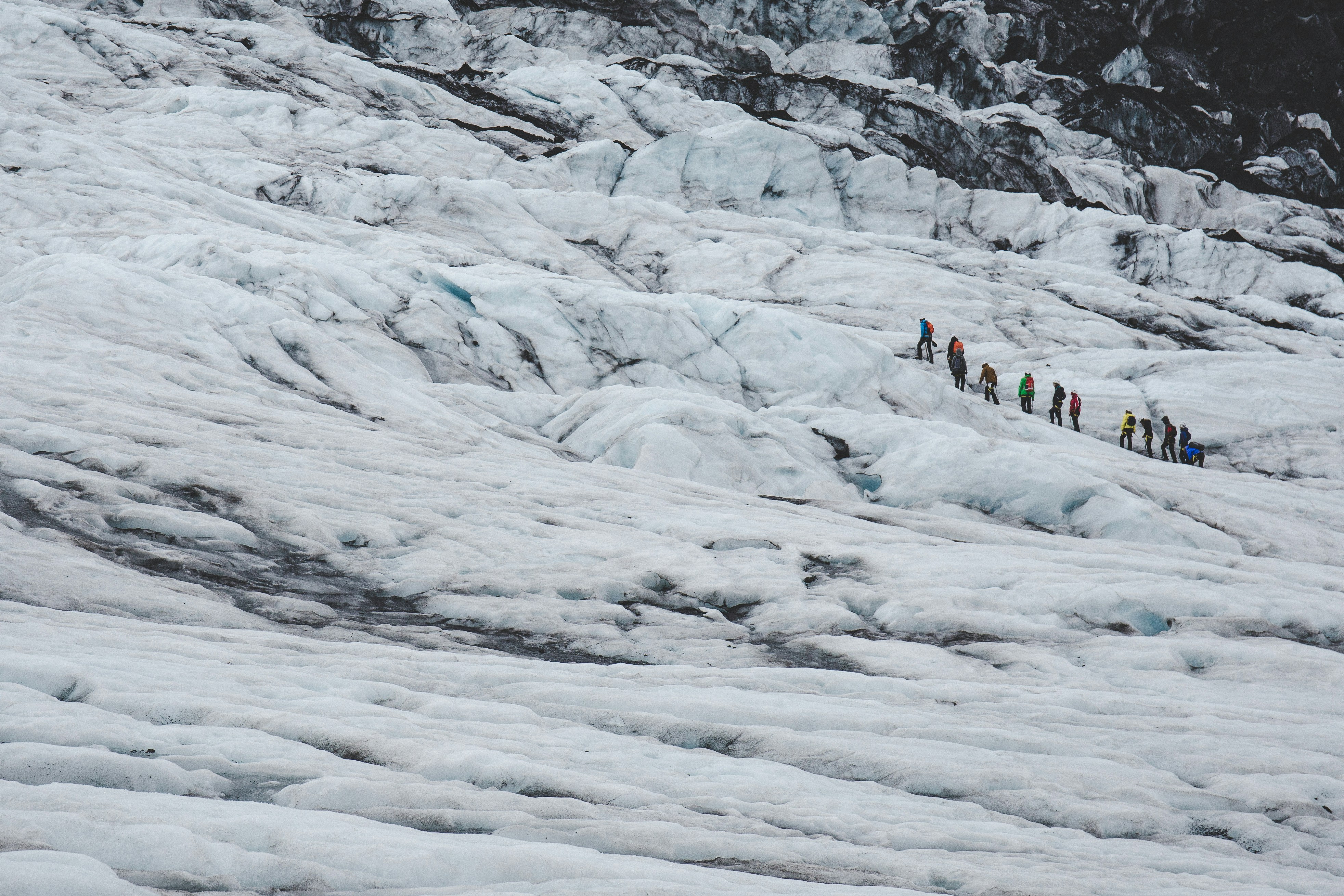 A group of people hiking on Vatnajökull Glacier in Iceland.