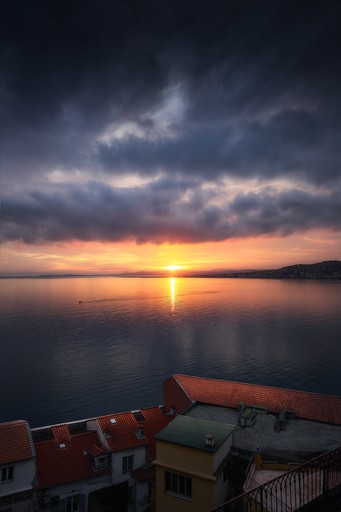 Cliffs next to a beach with a blue glowing moon