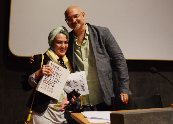 a women holding a book with a man