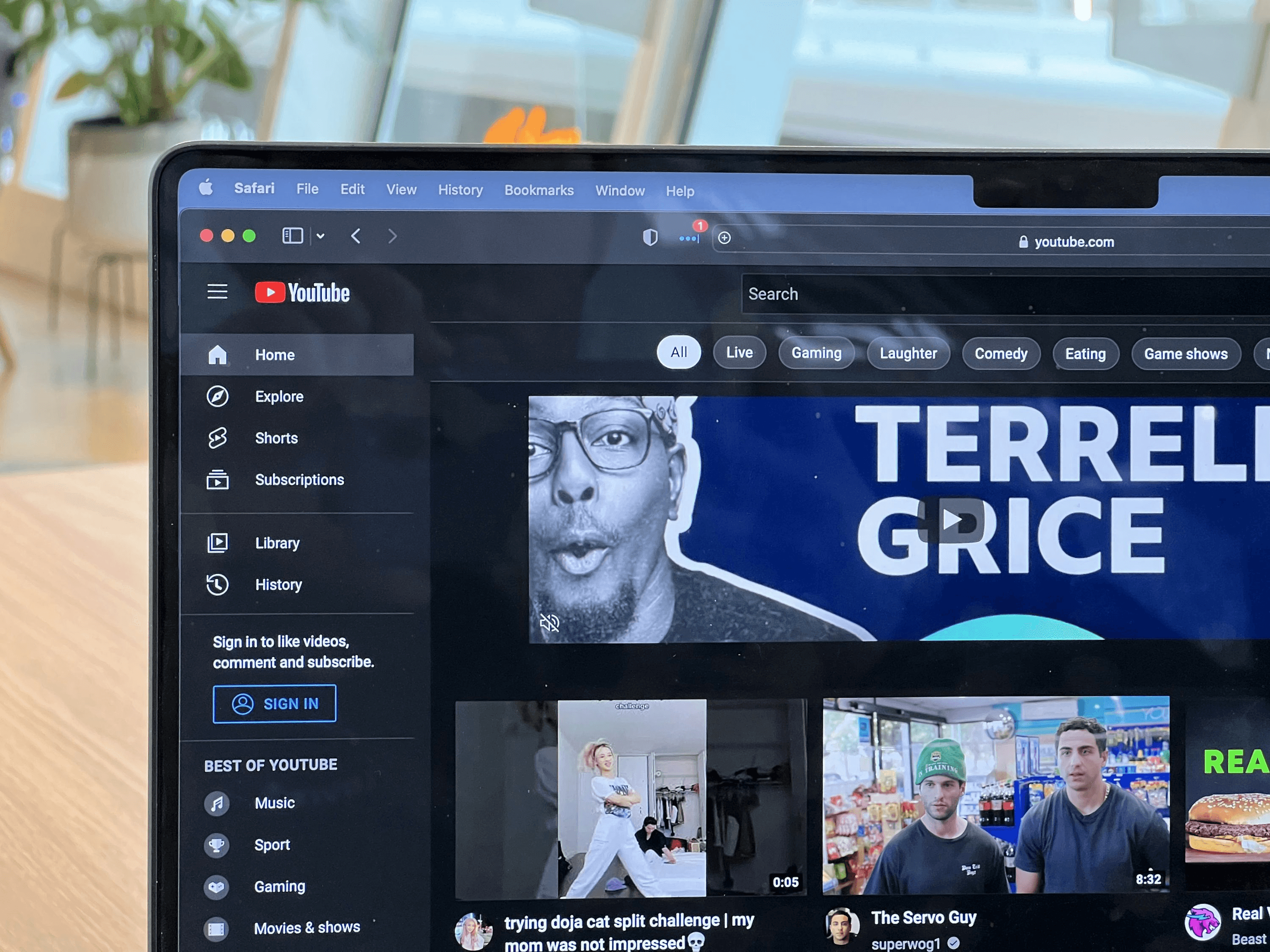 YouTube homepage displayed on laptop screen - How to Create a Faceless YouTube Channel