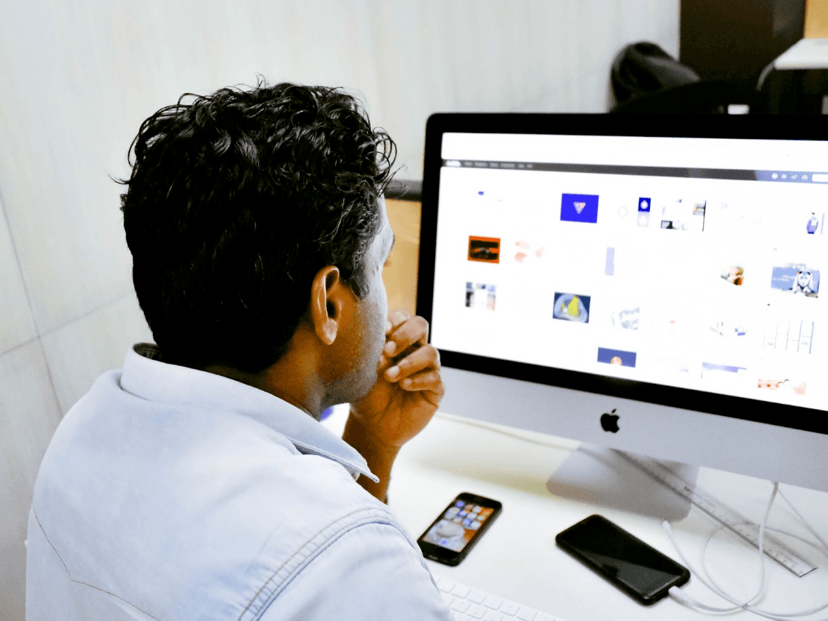 A man checking out his computer