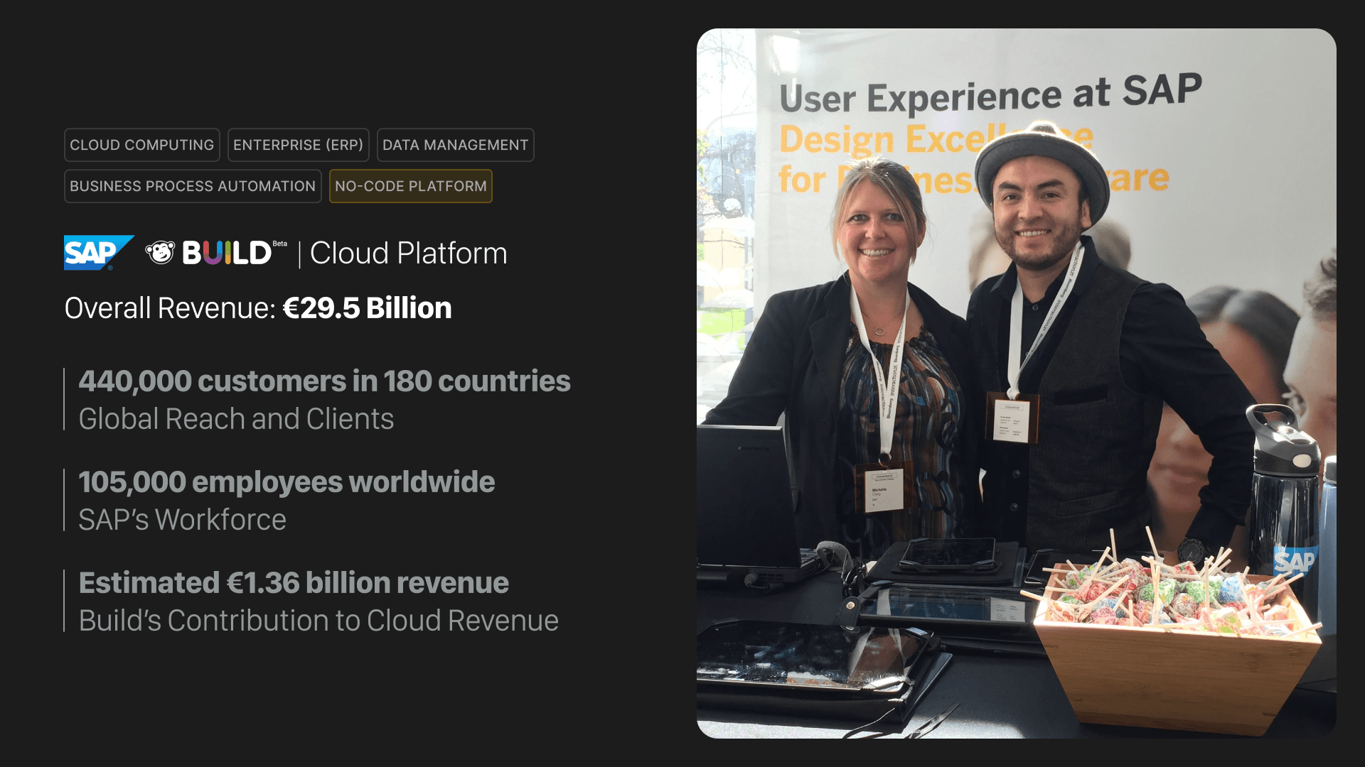 Modern home office setup with a monitor, ergonomic chair, keyboard, and indoor plants near a window with blinds.