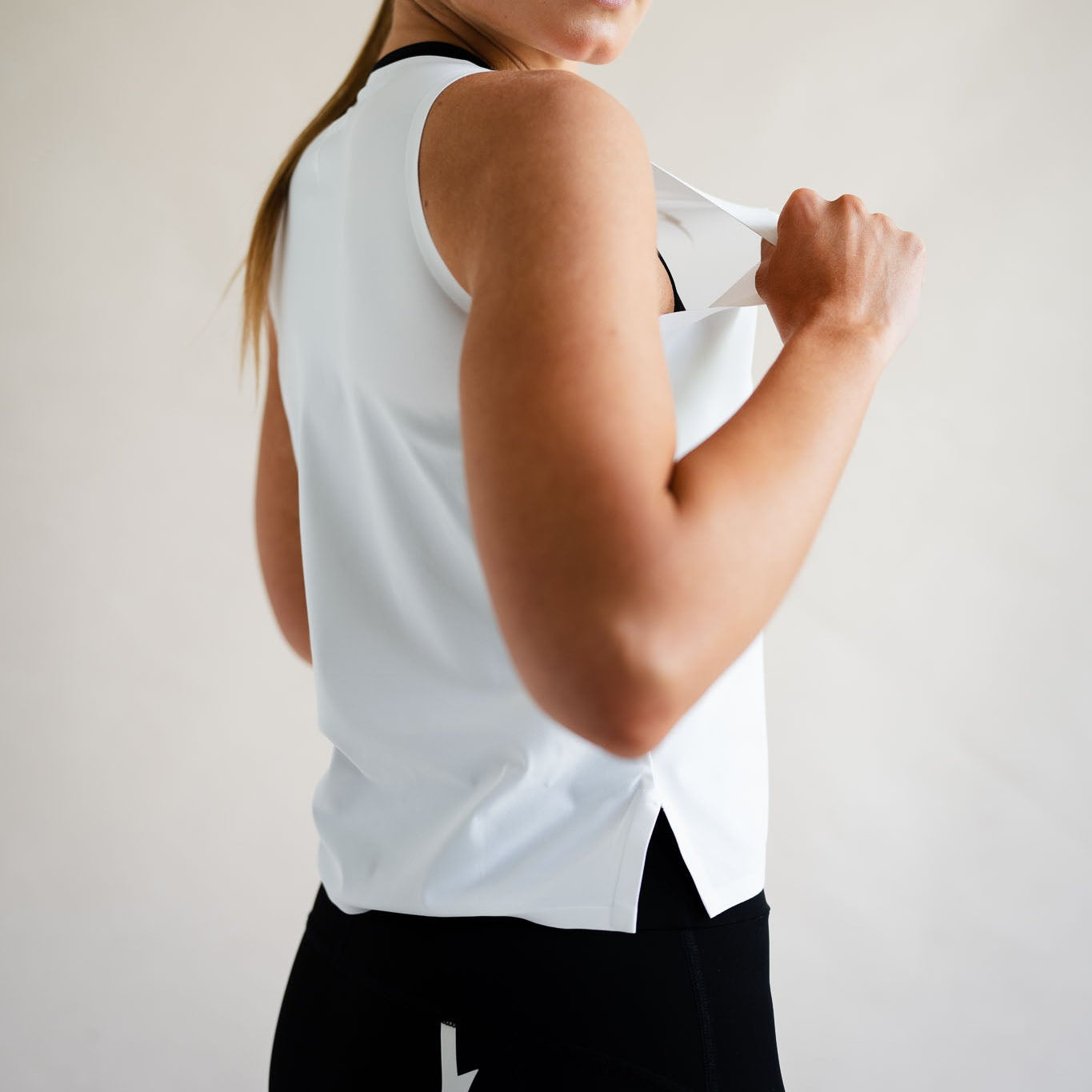 Cyclist in LUCA Meander vest in white, back view