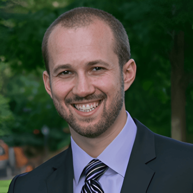 young lady (intern) smiling and folding arms