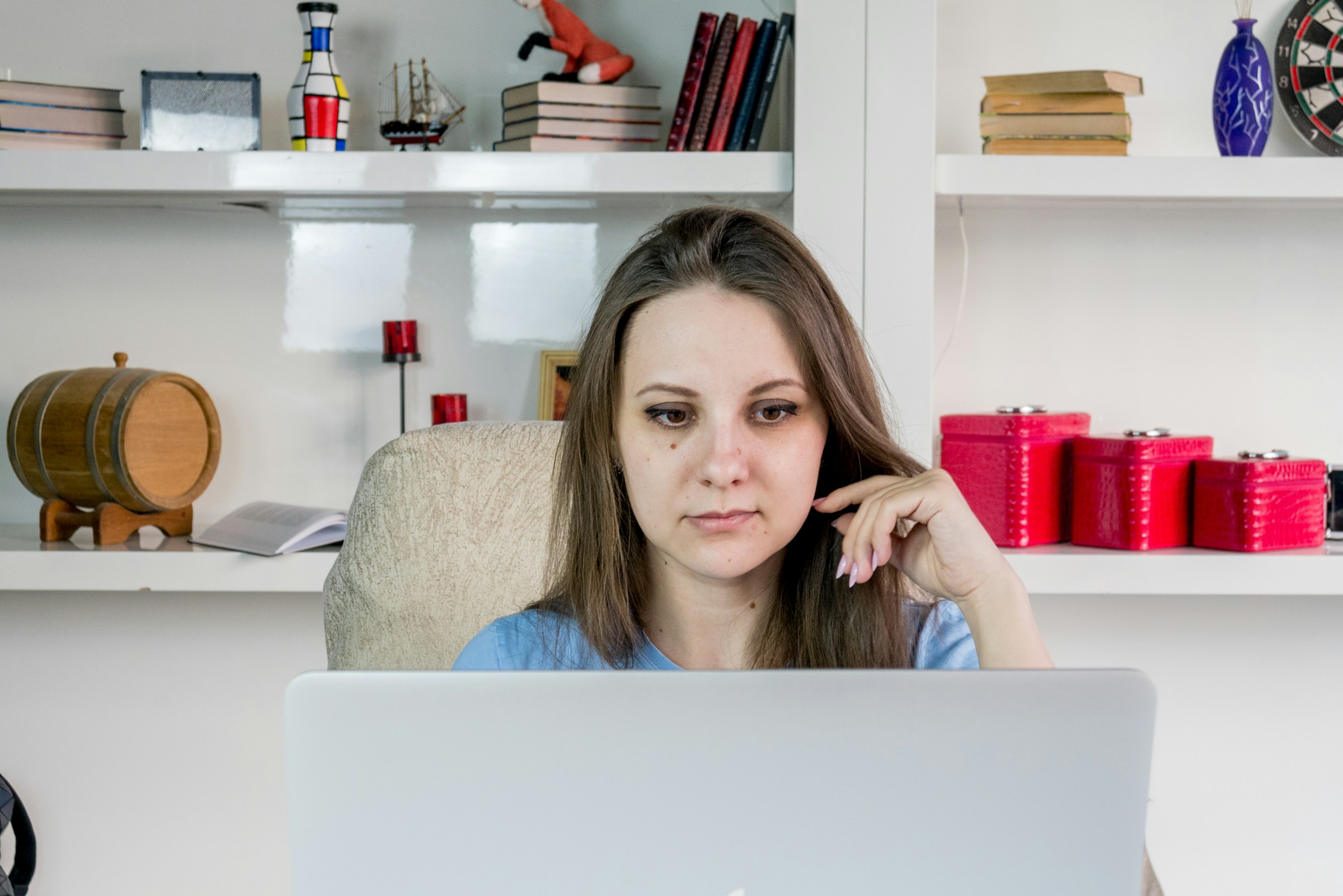 woman looking at her computer - Best eCommerce Website Builders