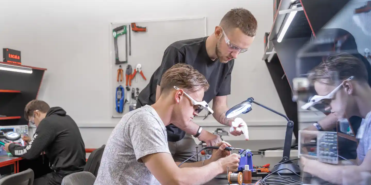 Startup engineer works in MakeIT Center makerspace on electronic hardware innovation and prototyping project