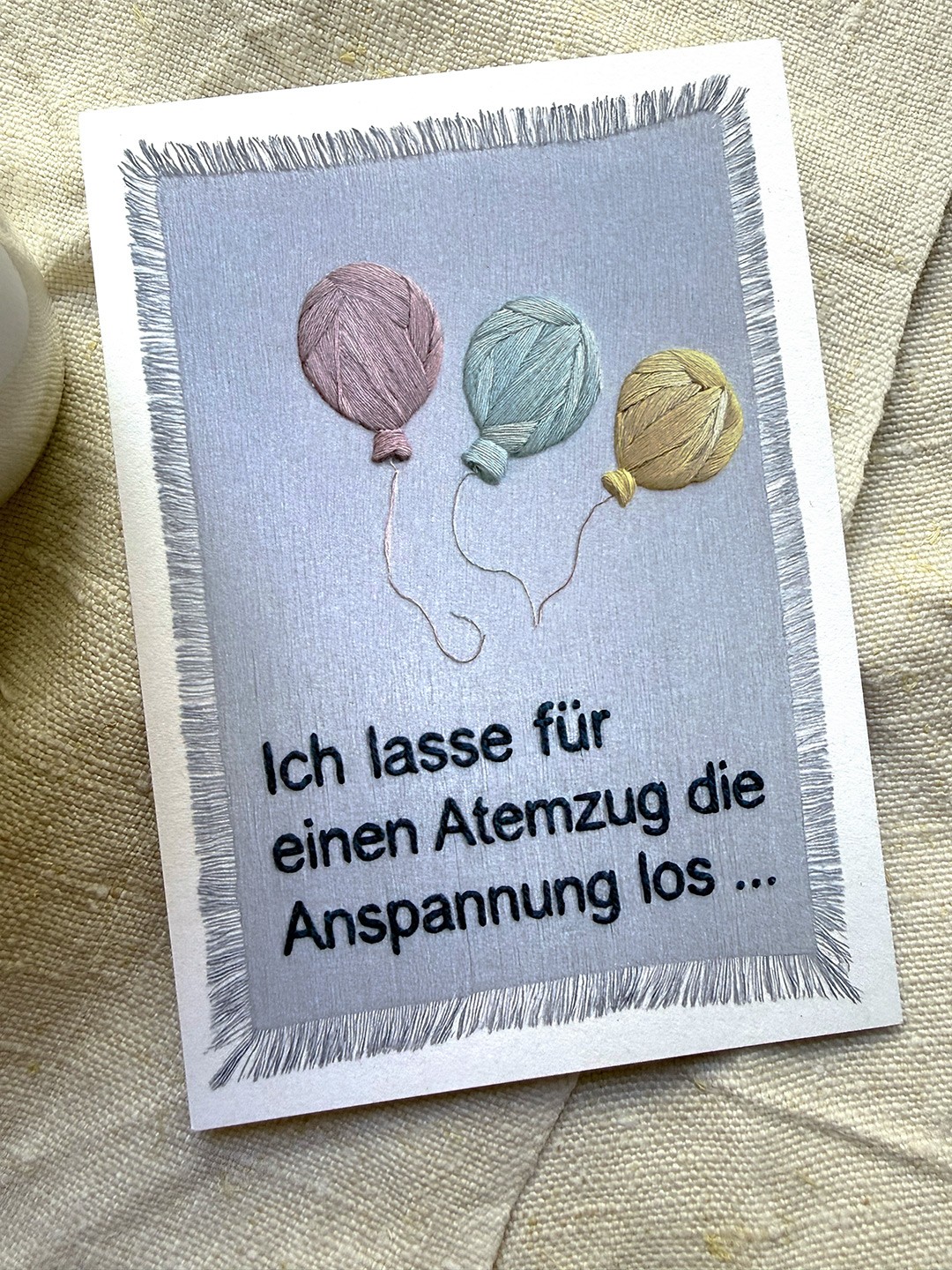 A Card with a embroidered Text