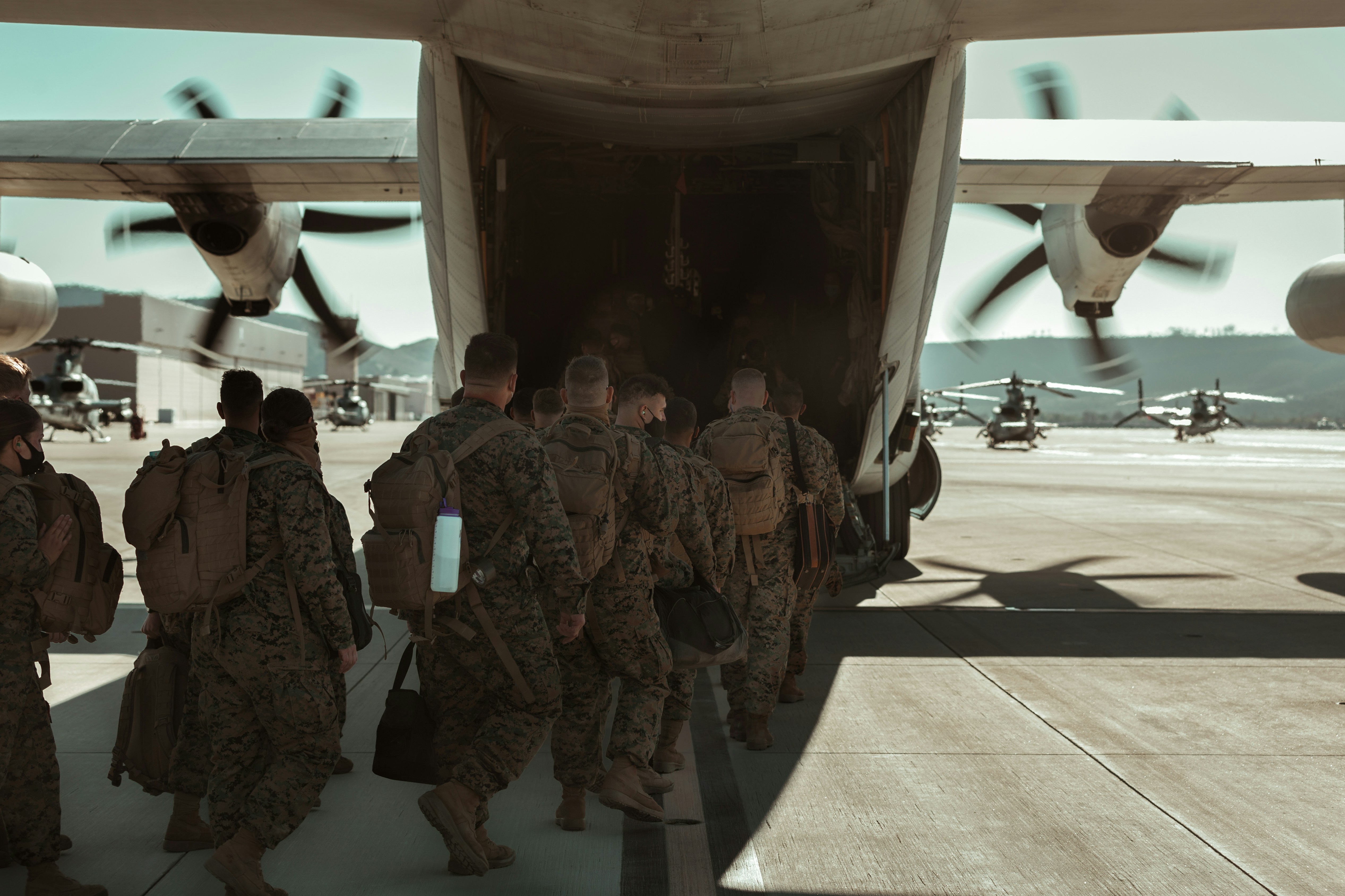 service members boarding plane