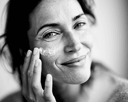 a woman sitting on a chair with her legs crossed